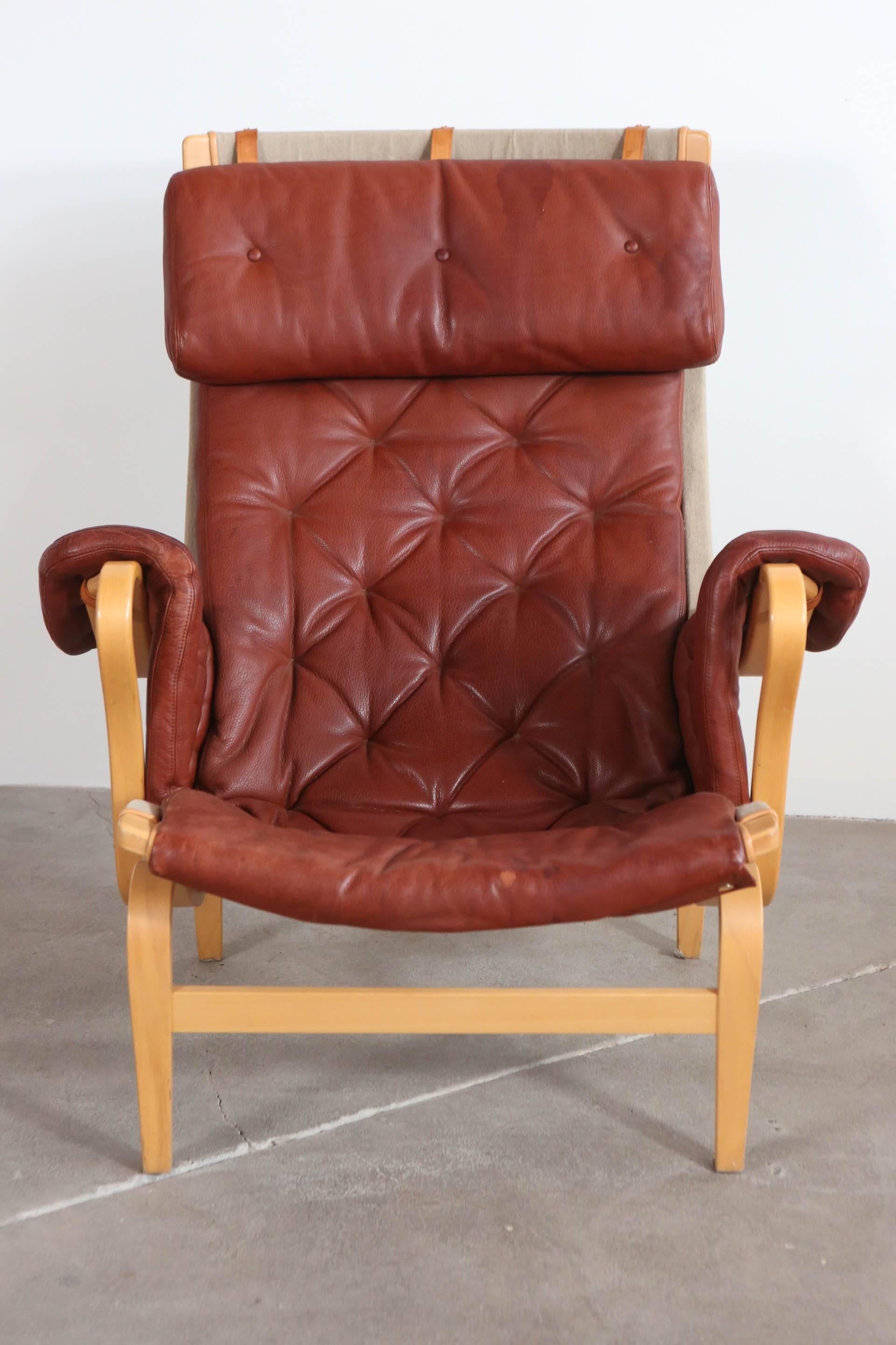 Pernilla chair by Bruno Mathsson upholstered in leather with a bentwood frame.