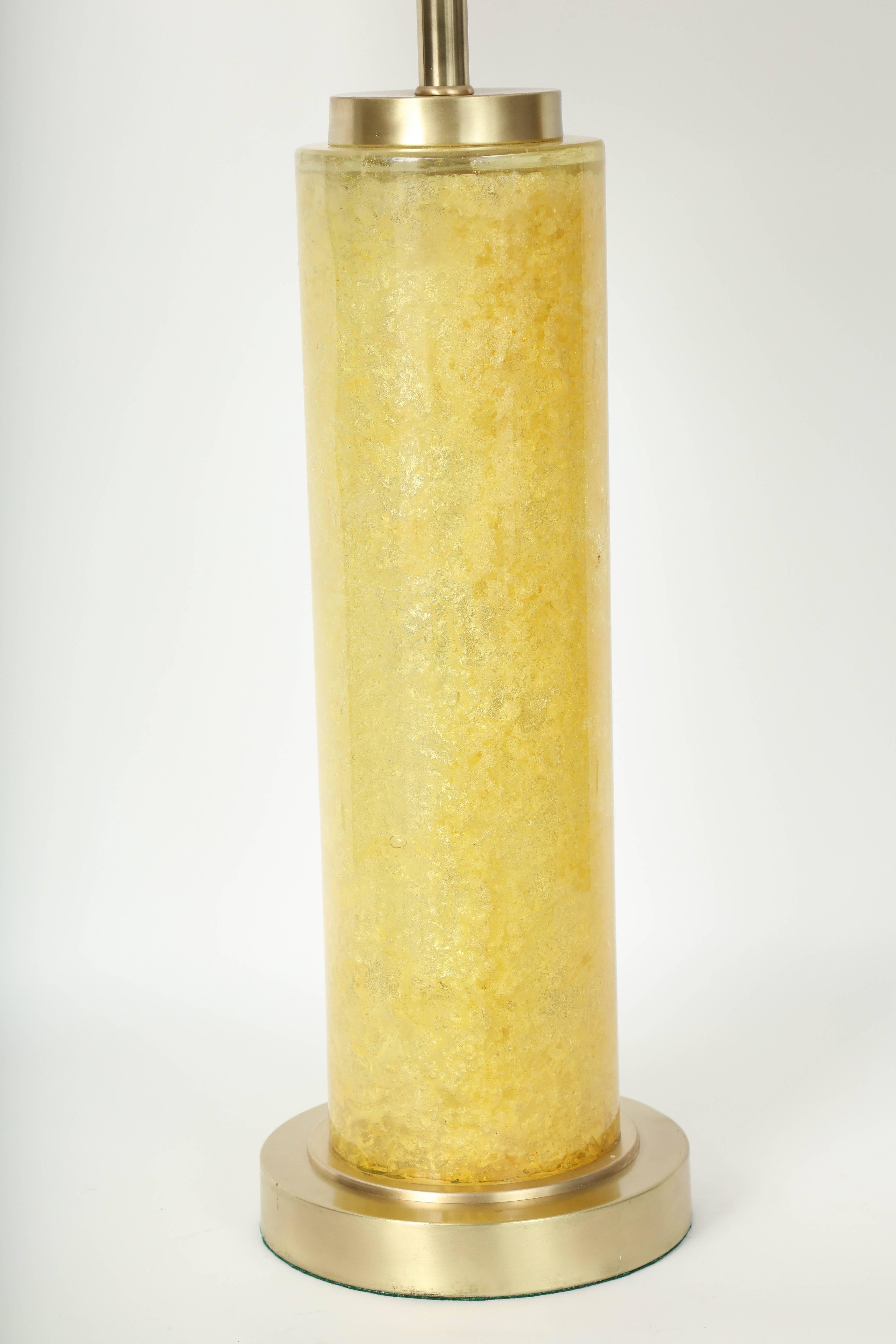 Striking pair of citrus colored compressed fractured resin column lamps on satin brass bases and featuring double pull chain sockets. Rewired for use in the USA.