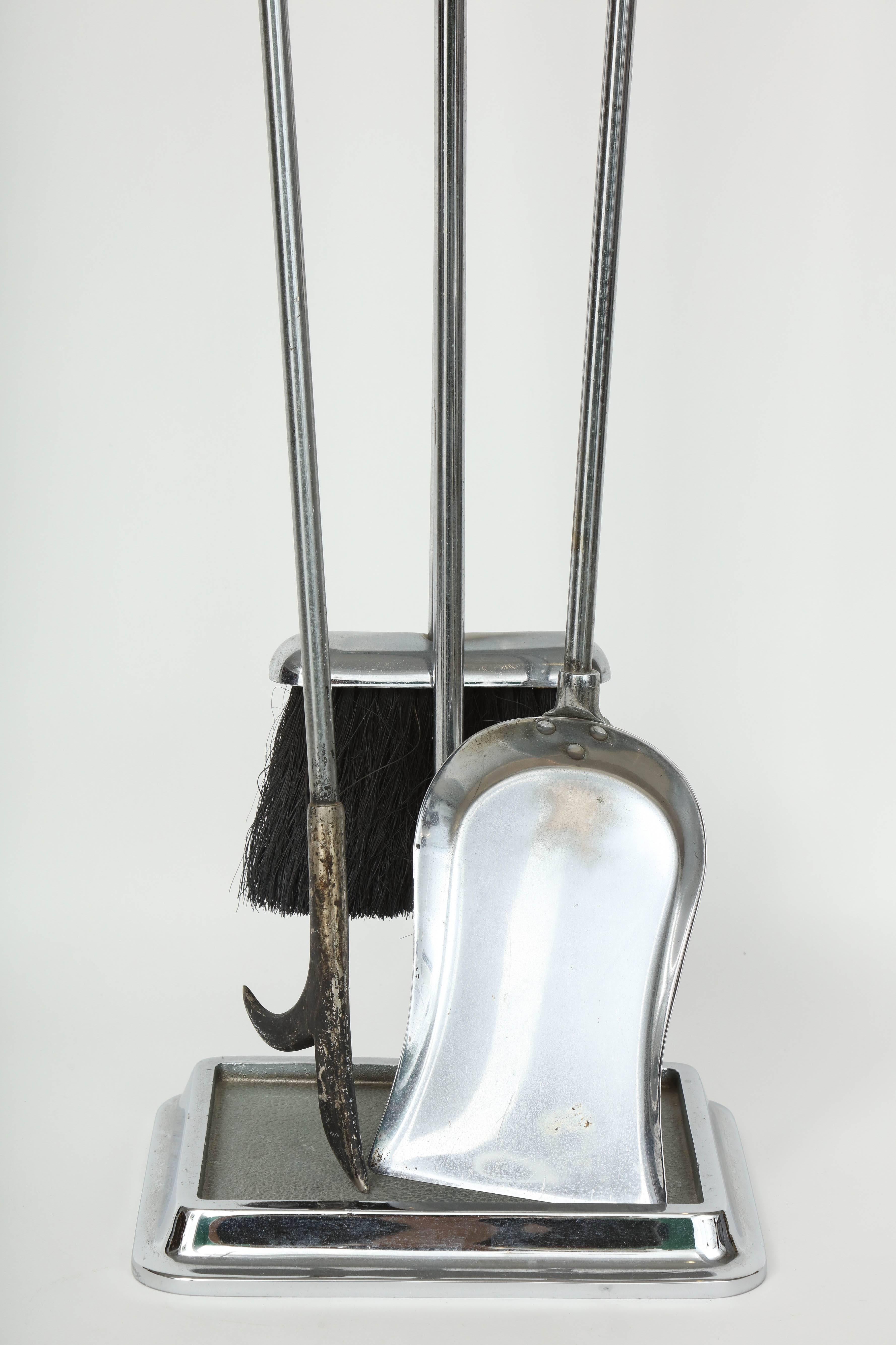 Mid-Century Classic set of nickel fireplace tools consisting of stand, poker, shovel and broom. Handles are solid nickel with a knob finial.