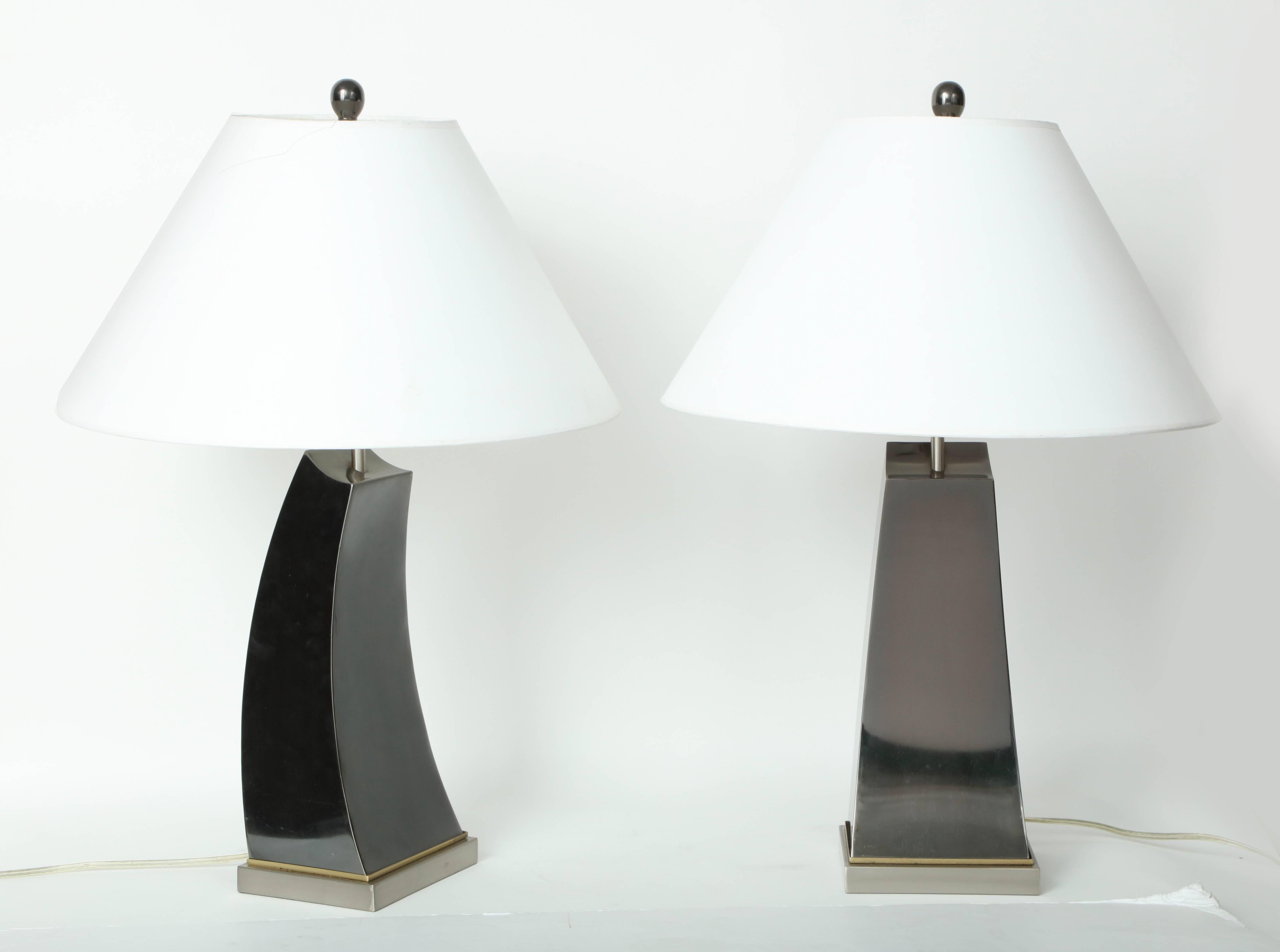 Pair of 20th century patinated metal lamps, wave shaped, polished brass bases.