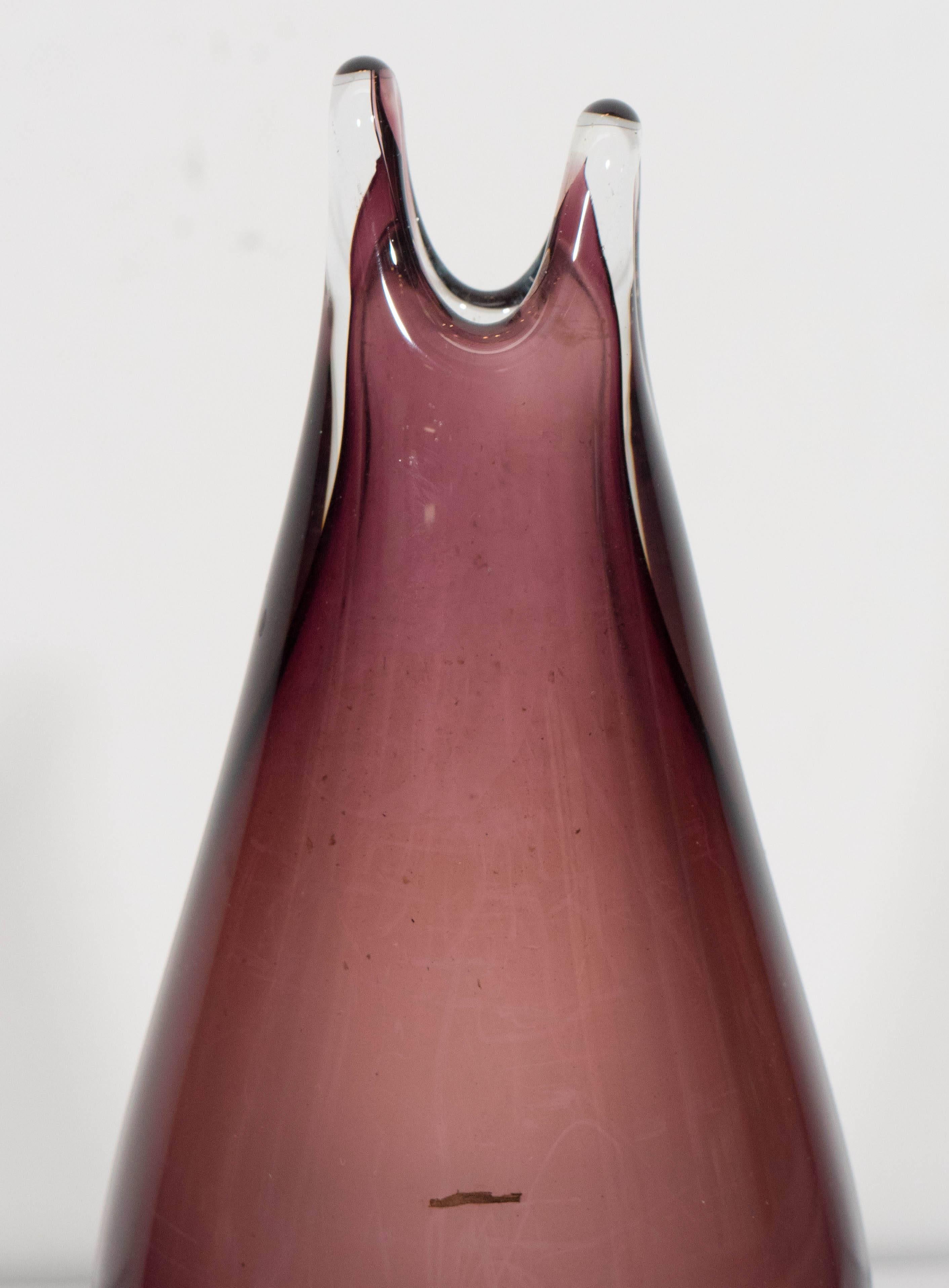 A vintage Murano glass teardrop form vase, with elongated lip, the interior in amethyst, cased in clear layer. The vase remains in very good condition, consistent with age and use, including some minuscule scratches to the base.