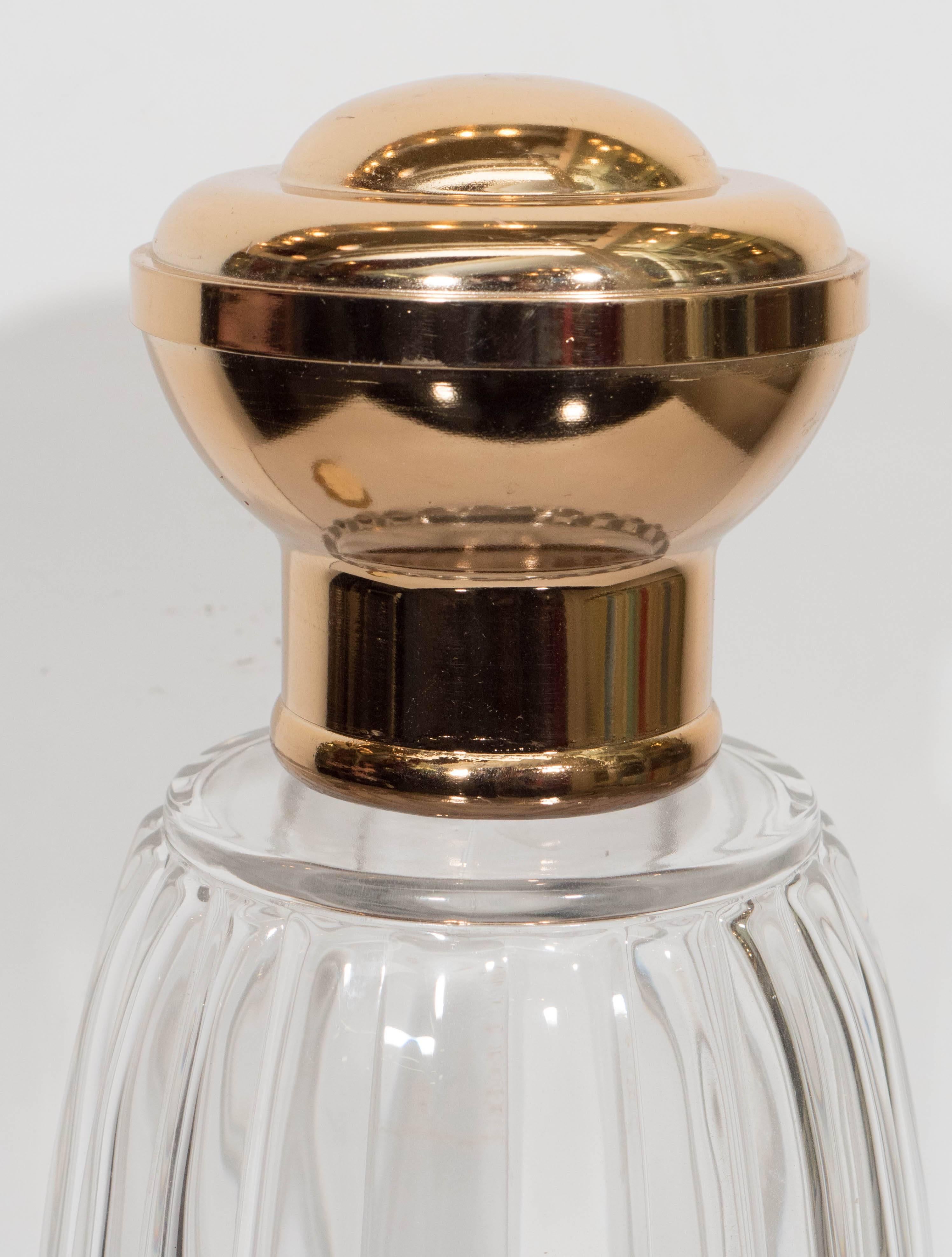 A large-scale factice boutique display bottle for Annick Goutal, with removable top on gadrooned glass body; opening to the bottom. Other than loss of spigot, this piece remains in very good condition.