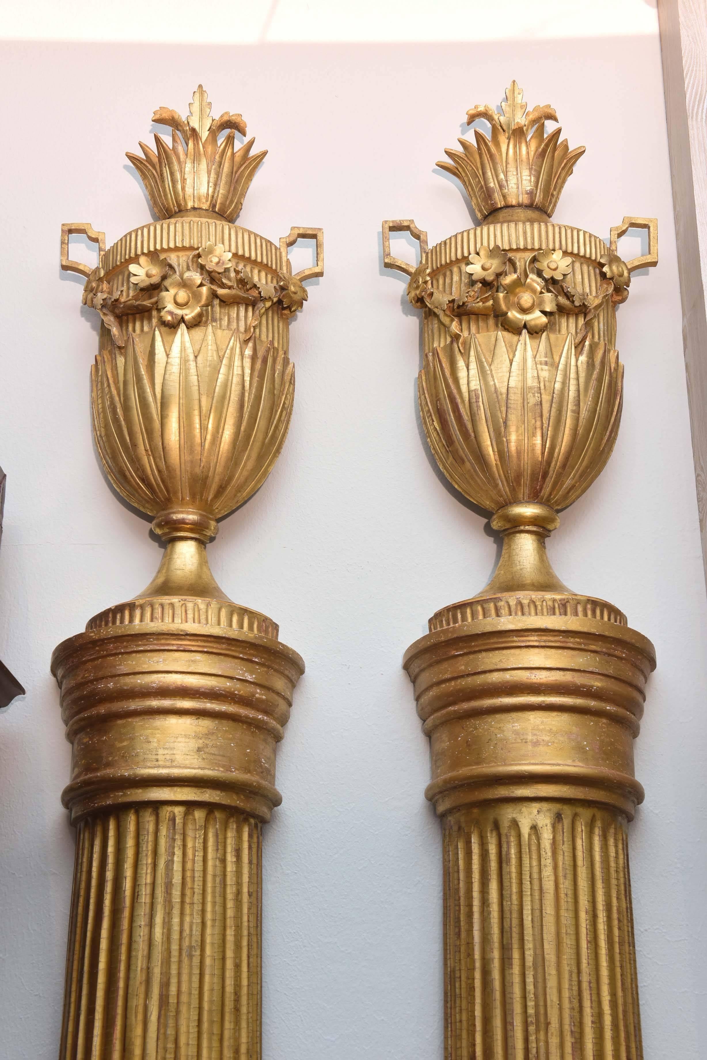 Magnificently carved, gilded and proportioned historic architectural elements, circa 1812. The urns, alone, are 33" tall and detachable from columns.

