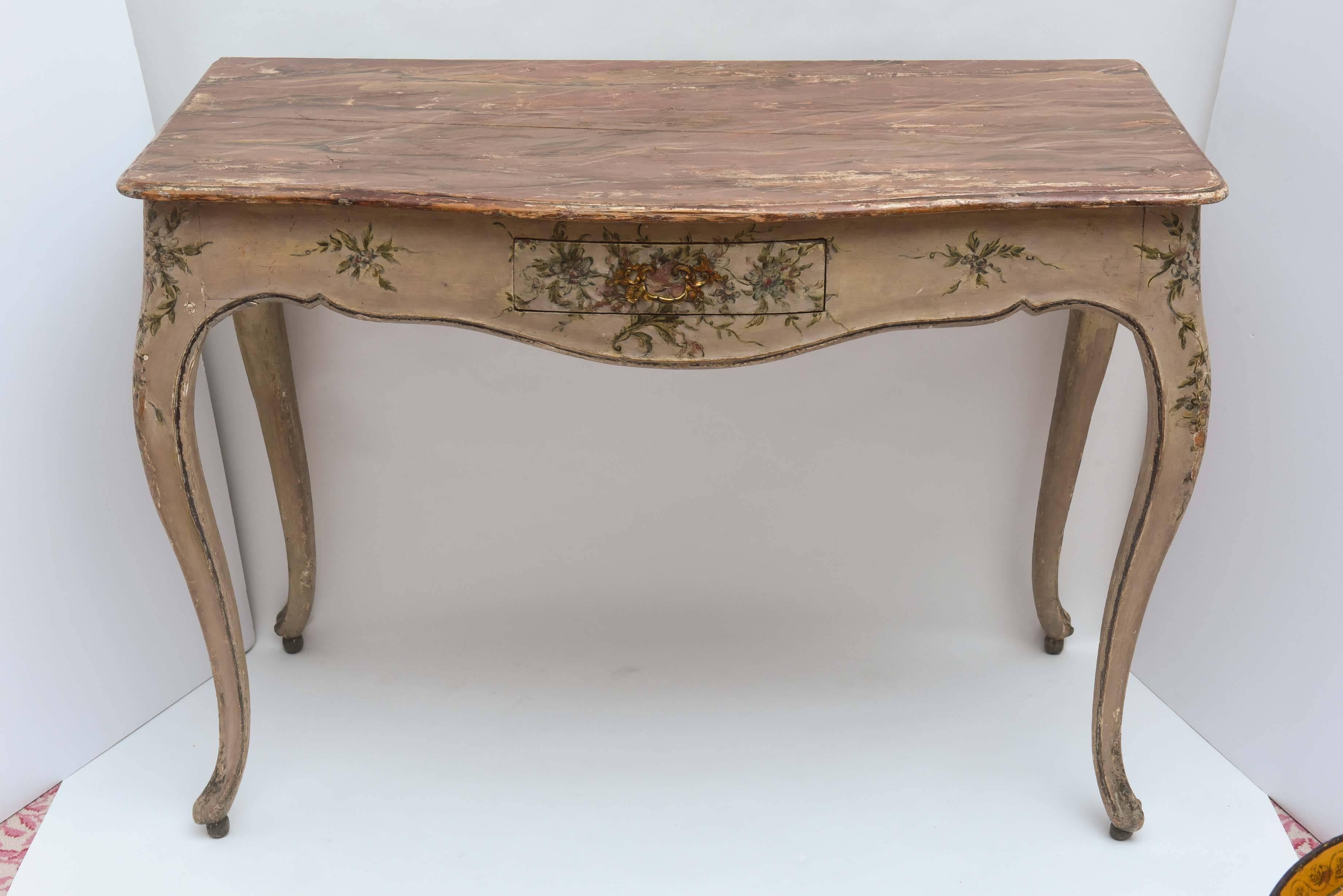 A fine Venetian ladies desk with original floral painting. Elegant style and dimensions.