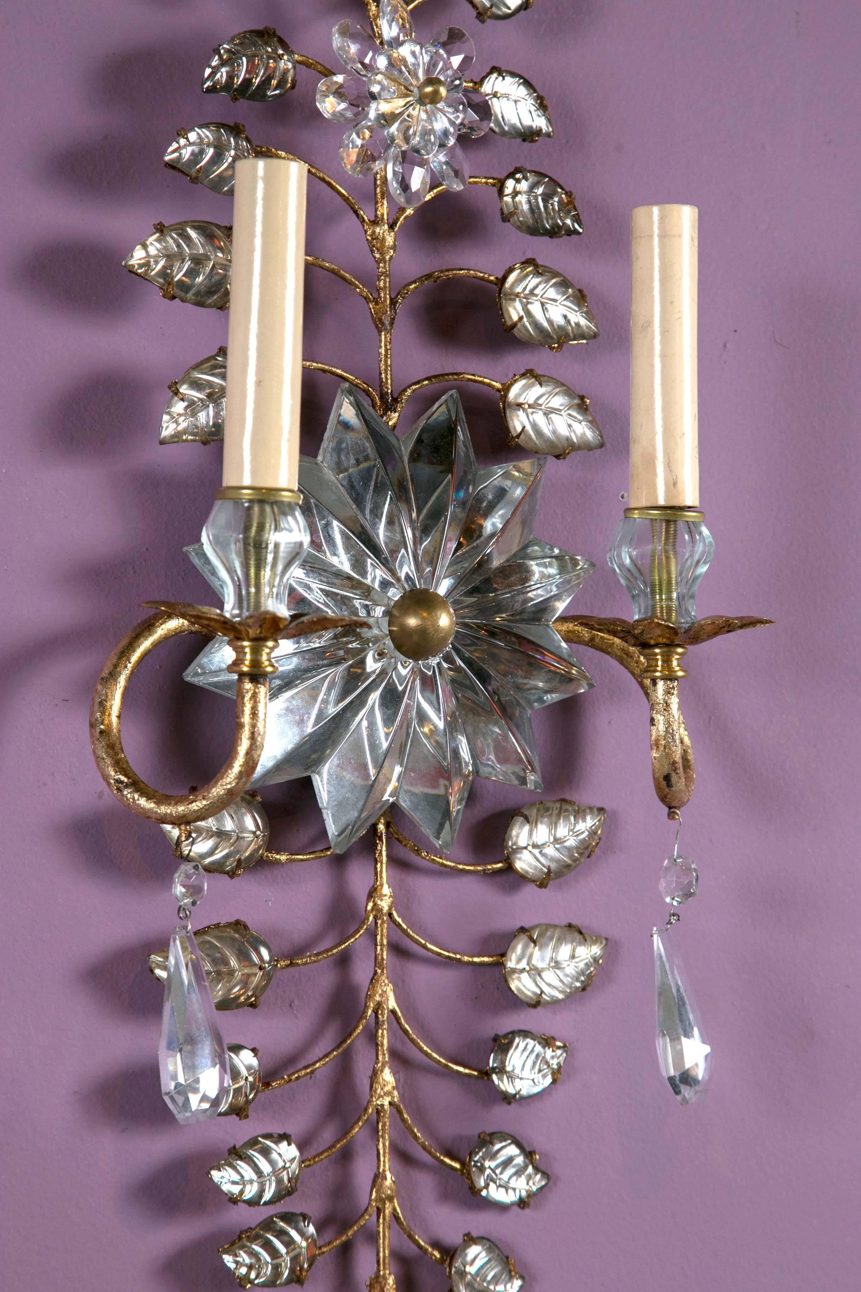 A set of three pair, circa 1930s, French gilt/crystal sconces with mirrored backplate. Price per pair.