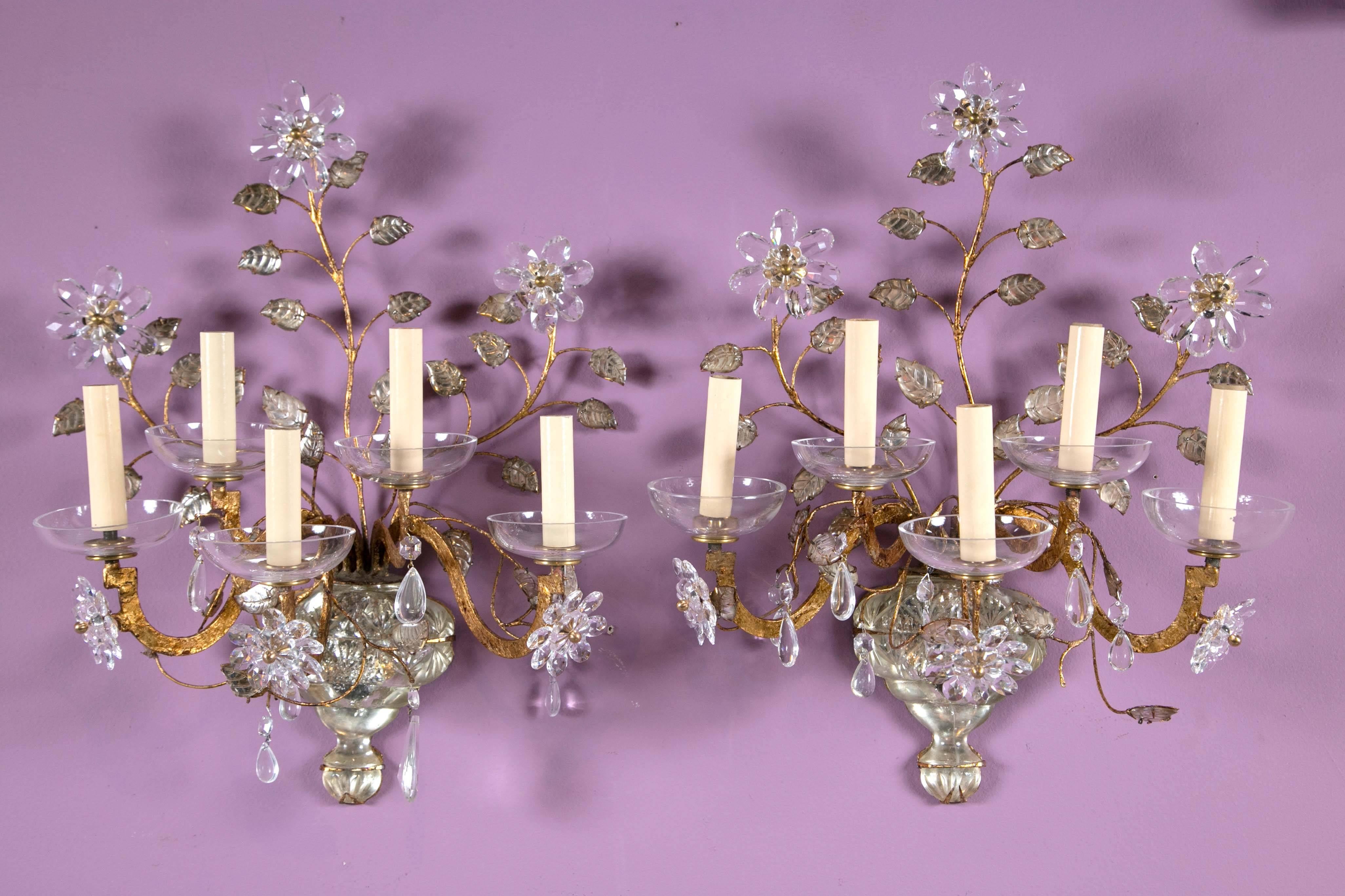 A stunning pair of French gilt and crystal sconces. Charming crystal flowers with amethyst crystal leaves, circa 1930s. Priced per pair, two pairs available.