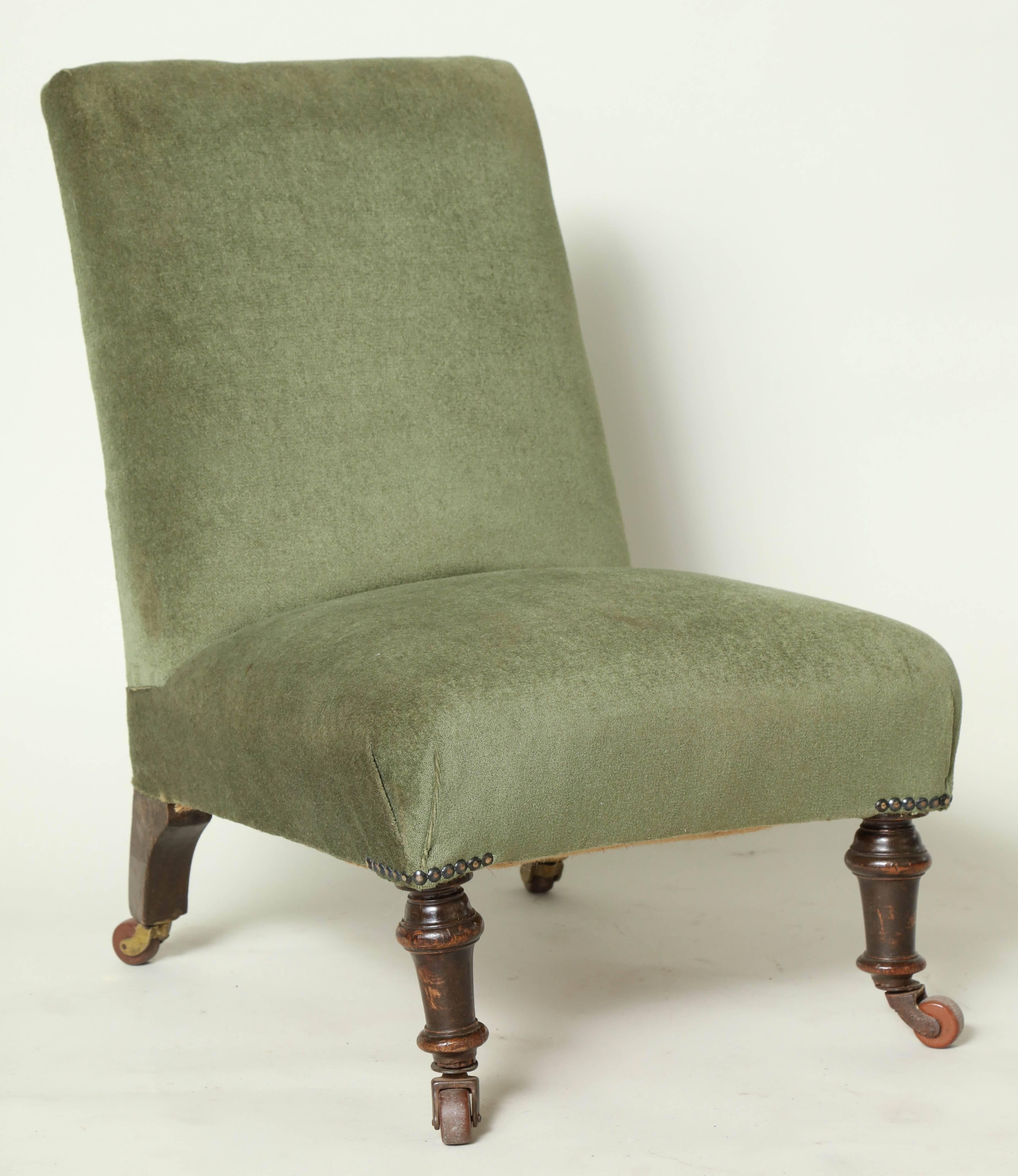 Good late 19th century English upholstered slipper chair, having turned front and shaped back legs, all with original ceramic castors.