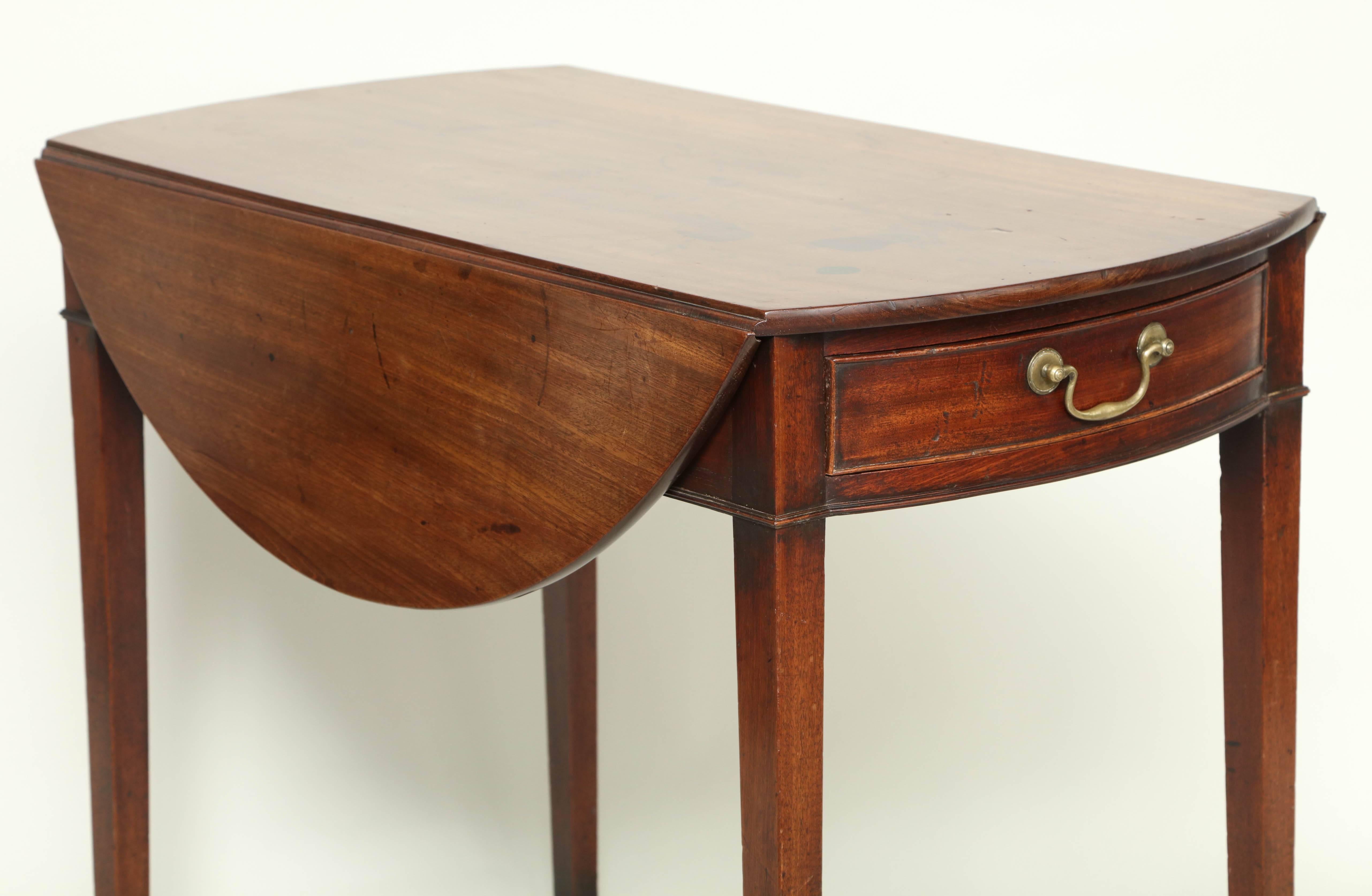 Fine George III mahogany Pembroke table in richly colored timber, the round top with simple edge over single drawer retaining original swan neck pull, over square tapered legs ending in original brass box castors.