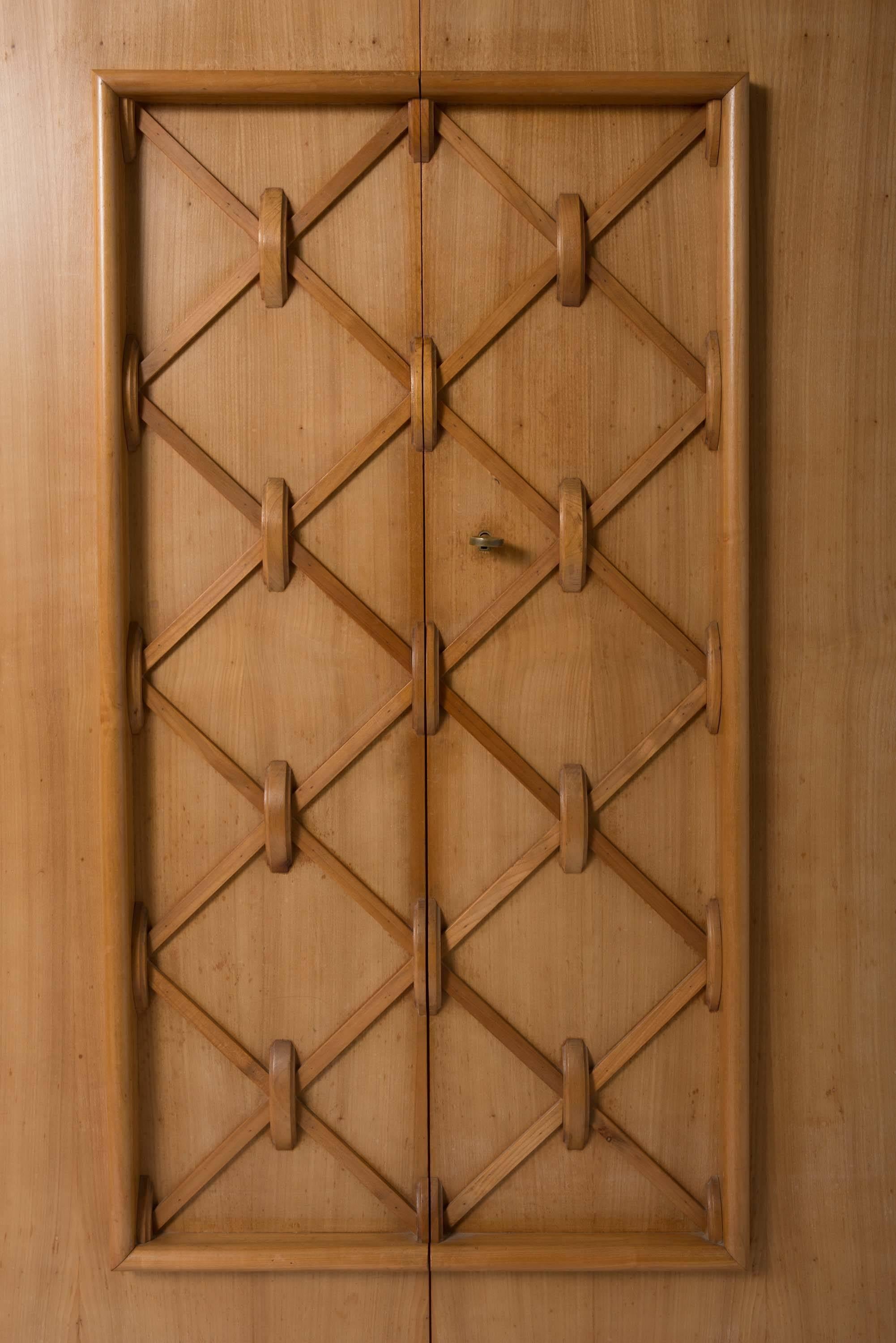 A French cherrywood cupboard of elegant shape with central geometrical design,
France, circa 1950.
Measures: 175 cm high x 150 cm wide x 50 cm deep.