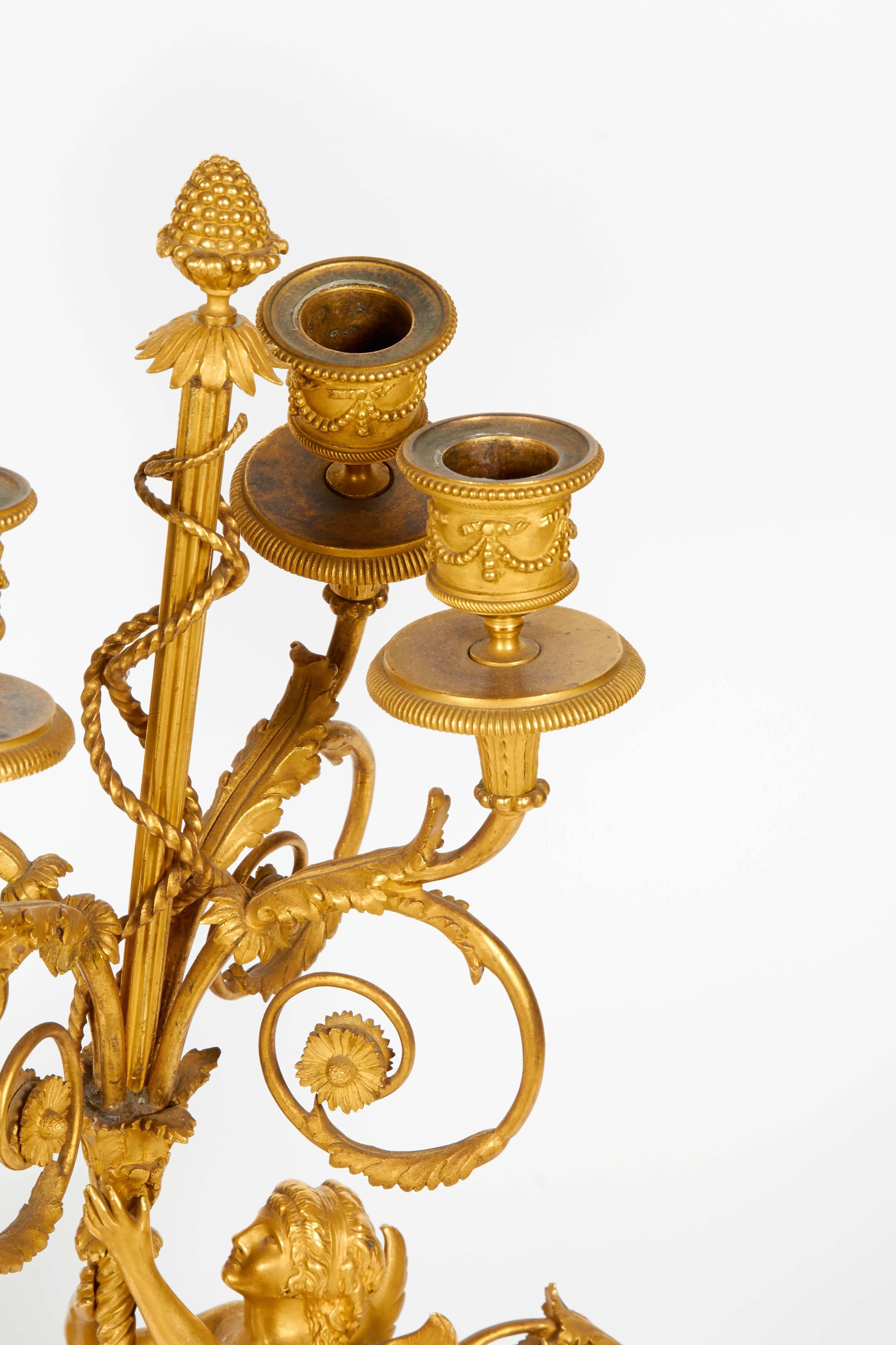 Very exquisite pair of French ormolu candelabra by Louis-Auguste-Alfred Beurdeley, (French, 1847-1919), circa 1880.

After the celebrated model by François Rémond.

Centered by jasper ware / wedgewood medallions to front and back. One with incised