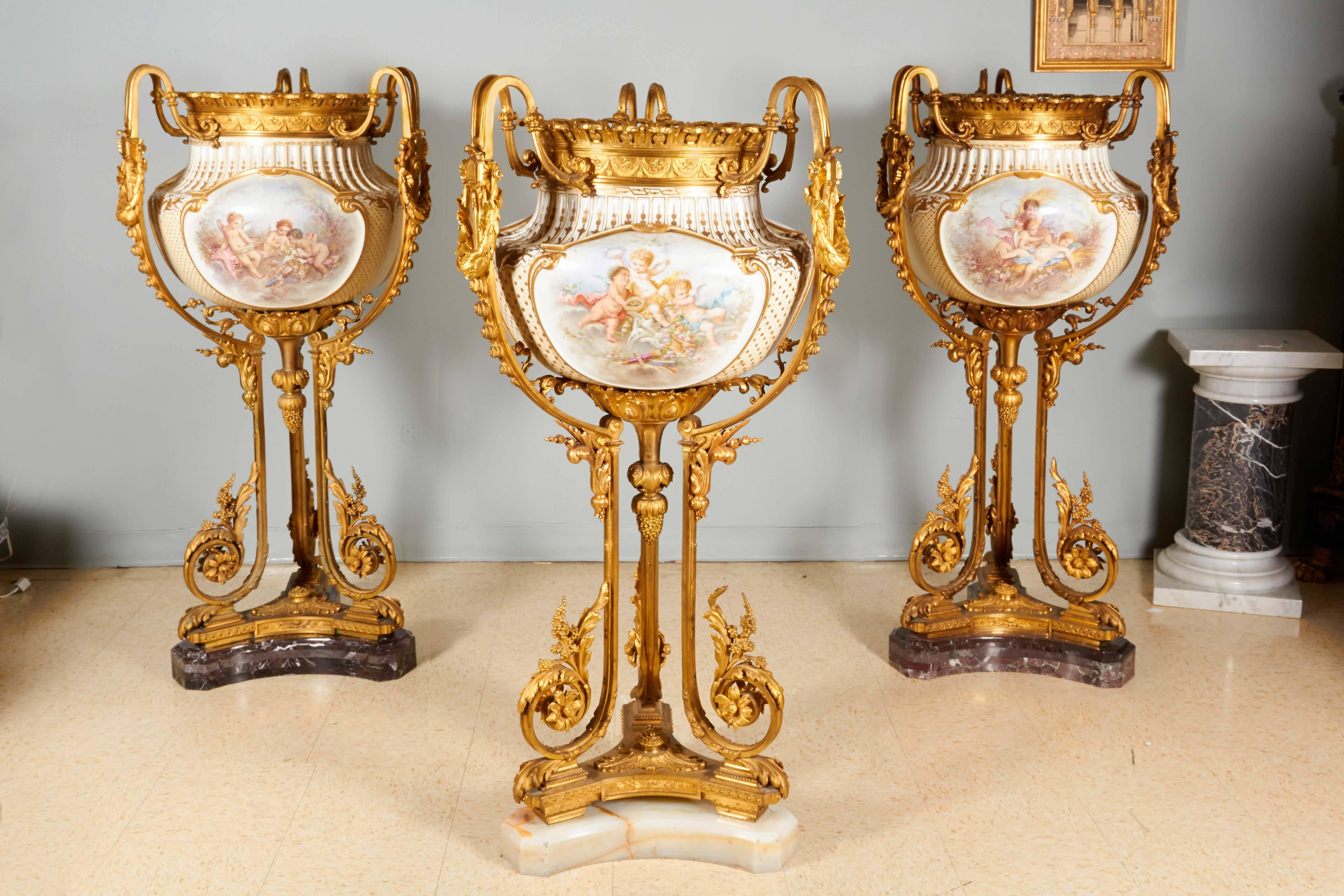 A highly important and palatial /monumental Sèvres-style porcelain jardiniere / planter vase, mounted in the finest ormolu. Most definitely commissioned for a royal family in Paris.

19th century, circa 1880.

Each body is molded with three large