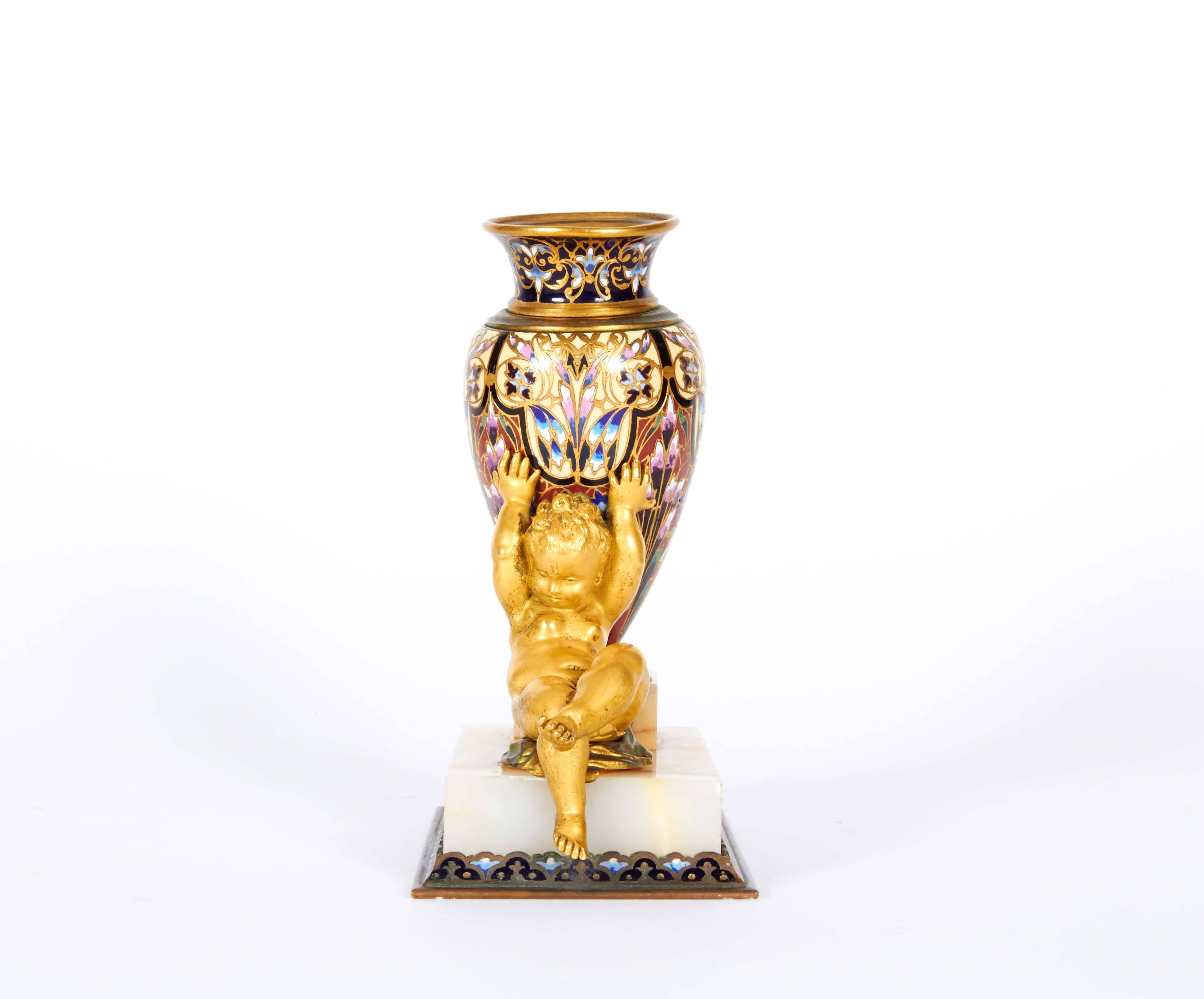 French ormolu onyx and Champlevé/Cloisonné enamel bud vase with a seated cherub/putti holding the vase.