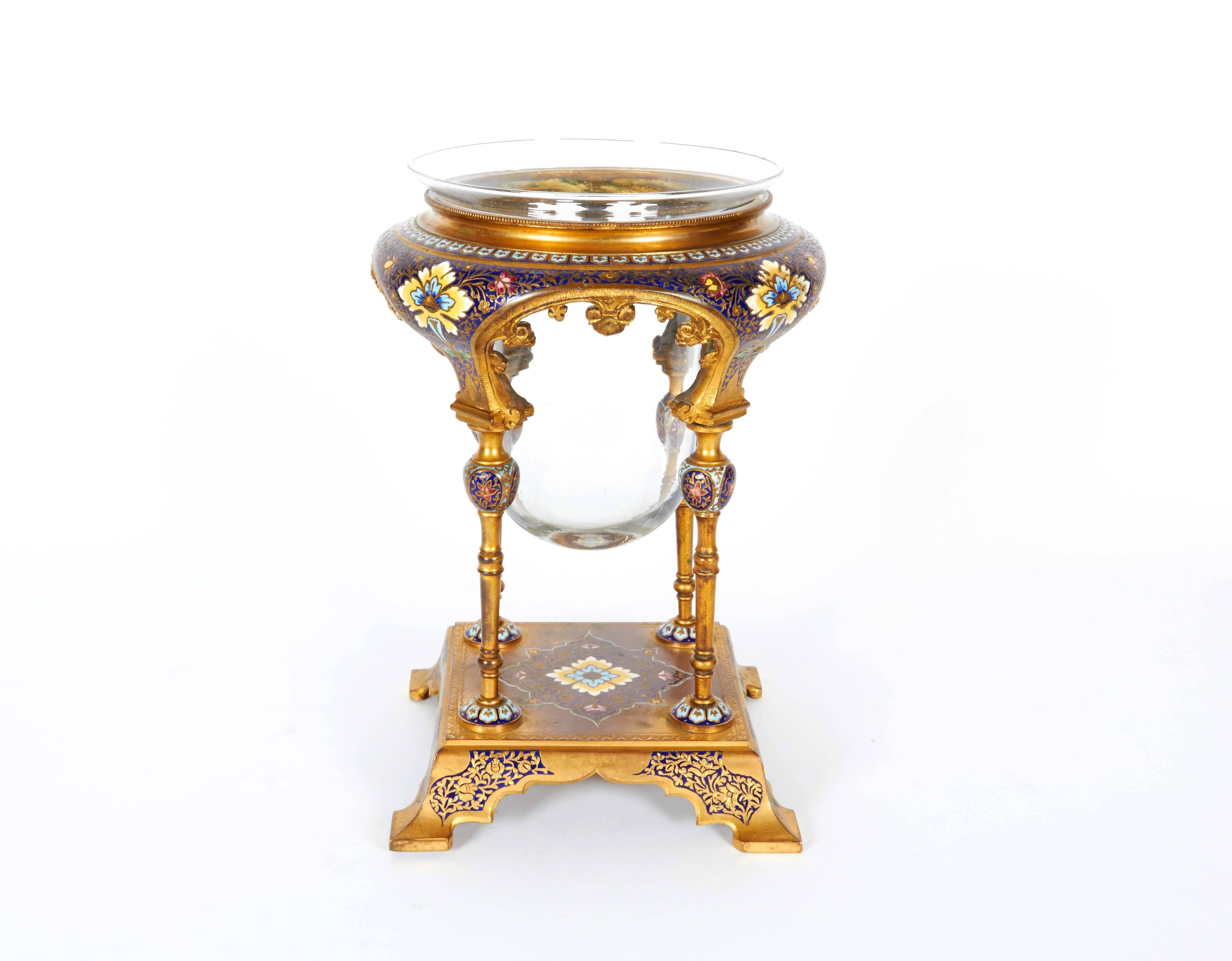 French ormolu and Champleve / Cloisonne enamel candle holder in the Moorish style.

19th century.

Original glass.