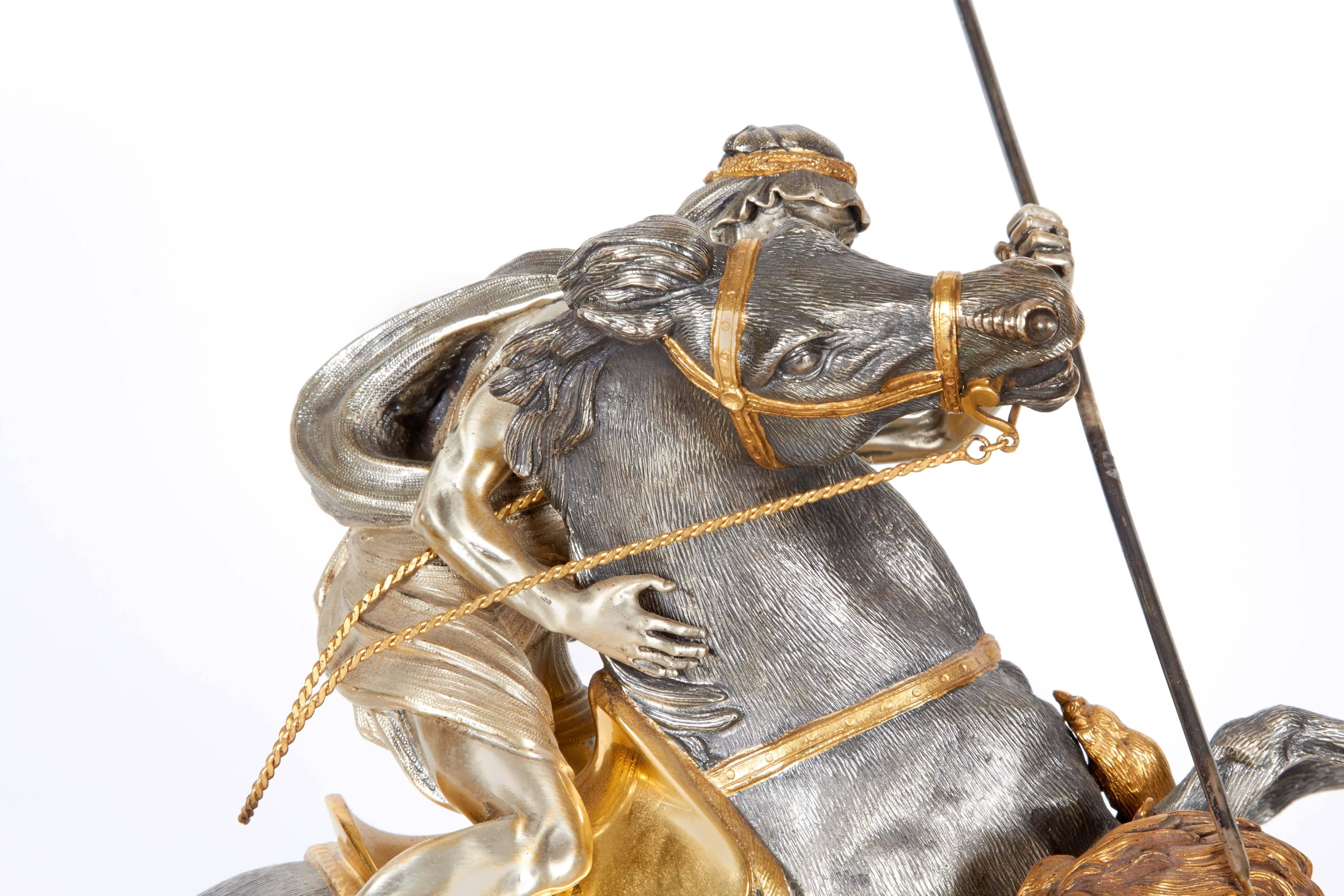 Fine Italian Silver and Silver Gilt Orientalist Sculpture on Malachite Base

Depicting an Arab horse rider defeating a lion. Solid silver. 

Marked 800 for silver.