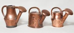 Three Copper Watering Cans