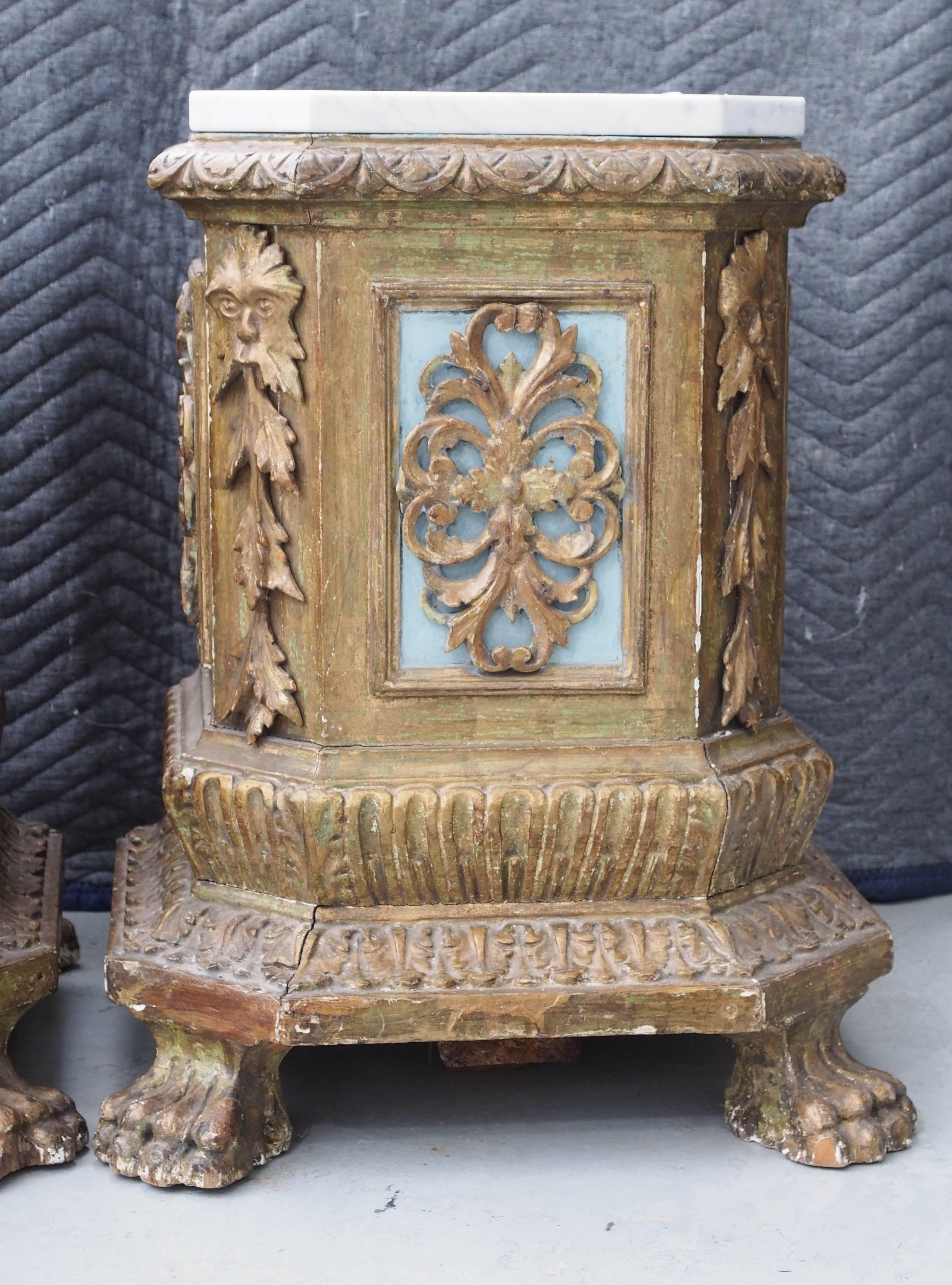 Pair of Italian giltwood plinths with later marble tops.