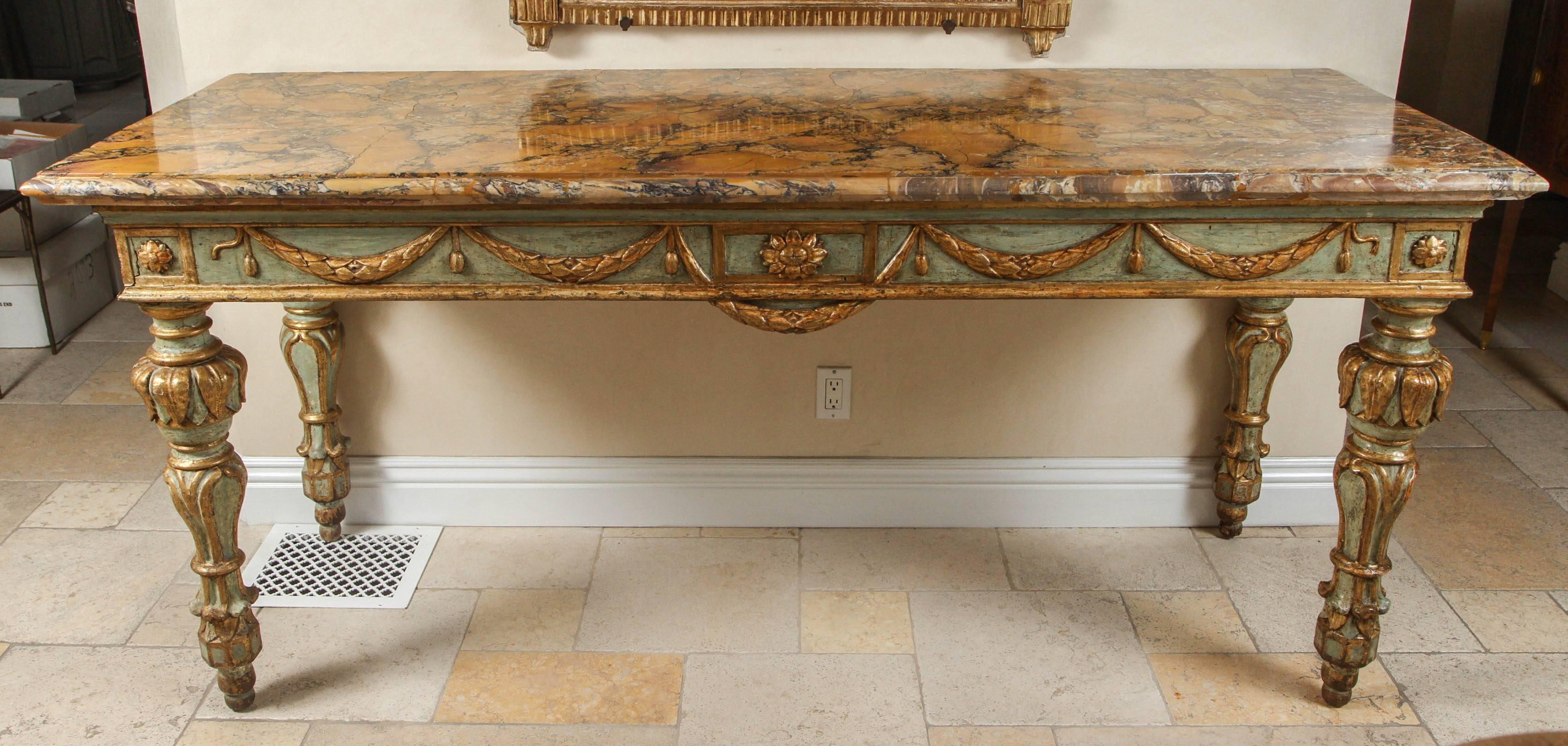 Late 17th-early 18th century large Roman console table with original painted top and carved giltwood.