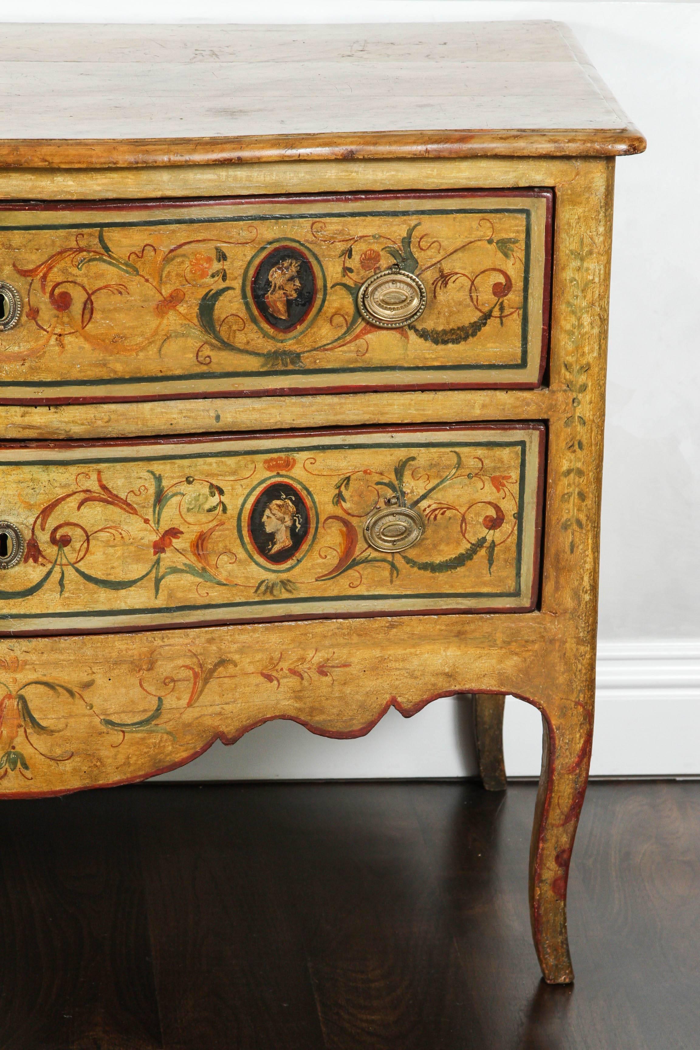 Early 19th to late 18th century. Italian Two-Drawer commode with faux hand-painted top. Profile portrait motif with colorful details.