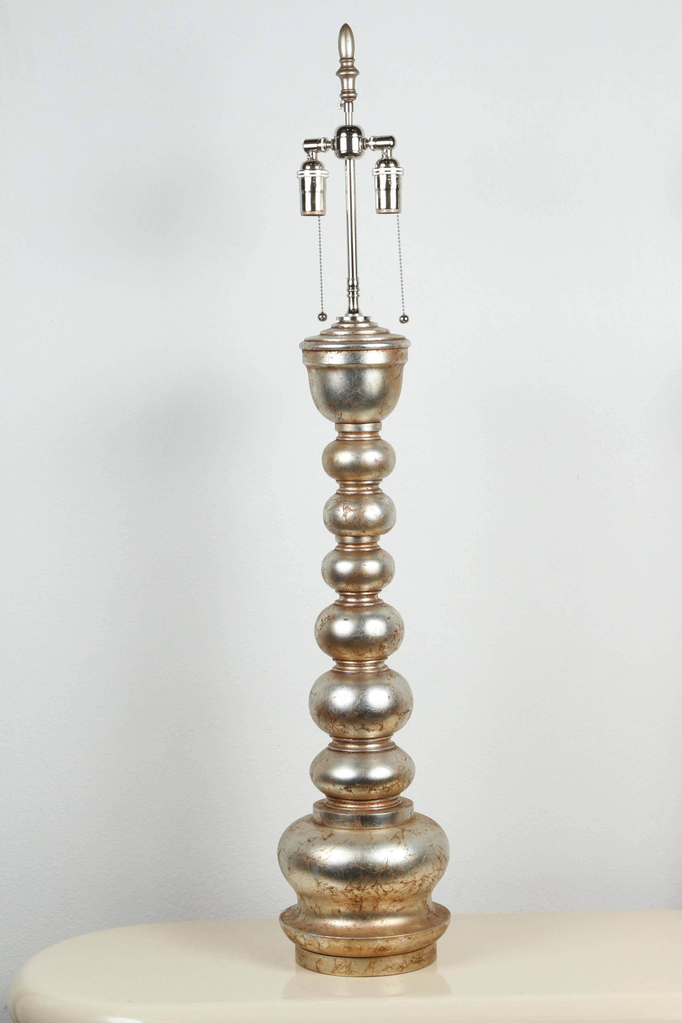 Pair of magnificent pagoda style lamps by James Mont. 
The lamps are finished in burnished glazed silver leaf and have been Newly rewired with polished nickel double clusters.
This design was made in two different sizes. ( This is the big one.)