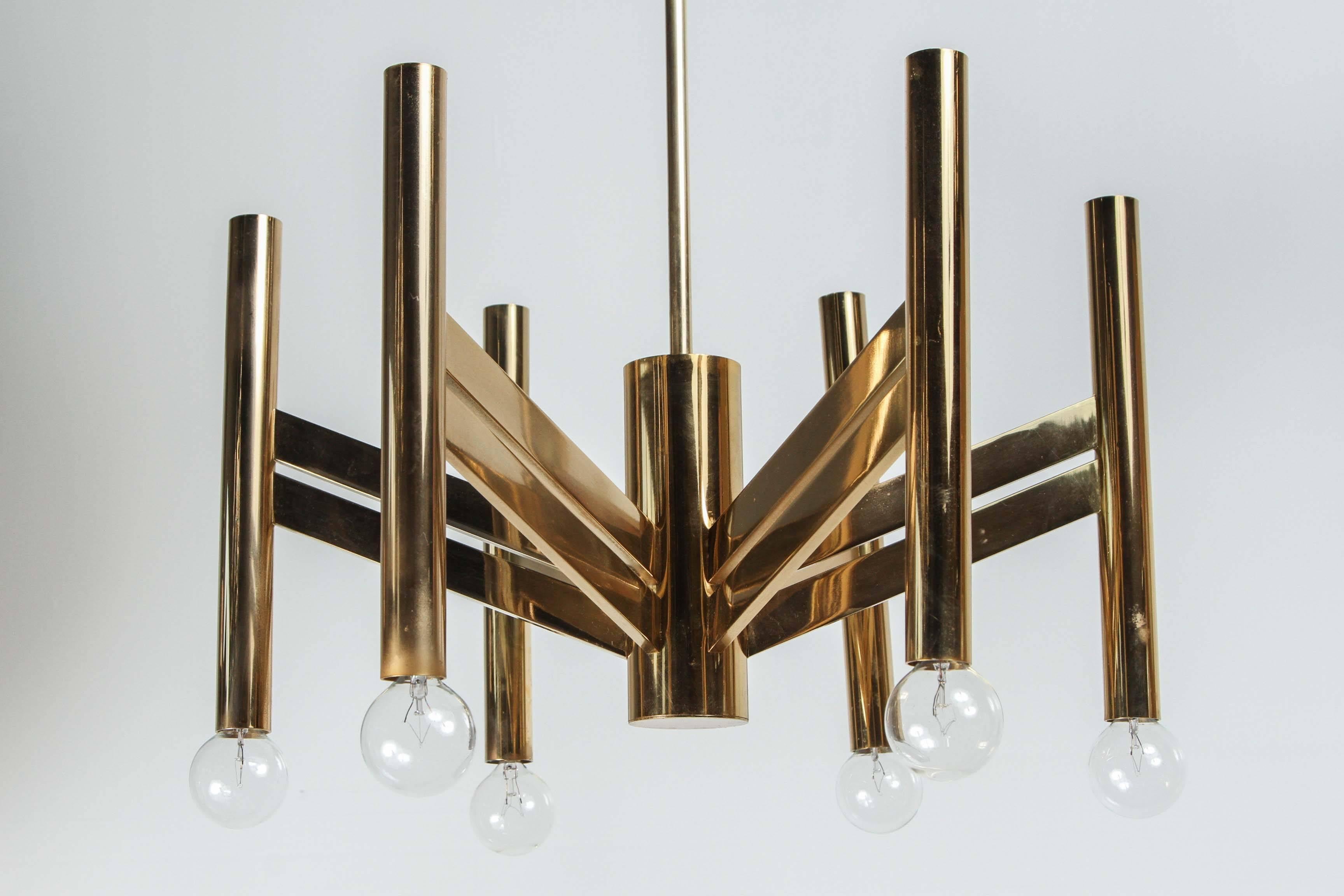 Beautiful and elegant geometric chandelier by Sciolari.
The brass / gold finish is enhanced by its simple design with candelabra globe up lights. 
The fixture has been newly rewired and comes with a 12