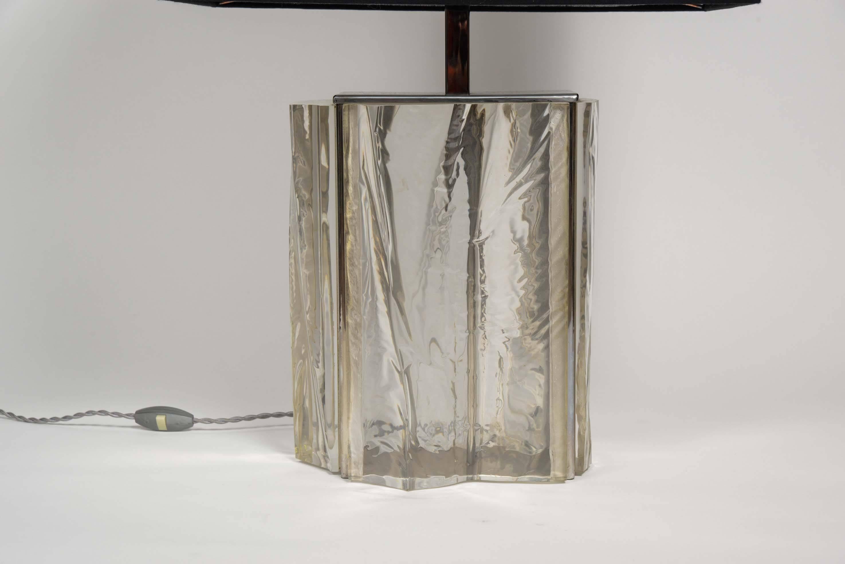 Nice lamp made of a chrome rectangular structure and different panels of carved and polished lucite. Finished by a large dark grey shade.