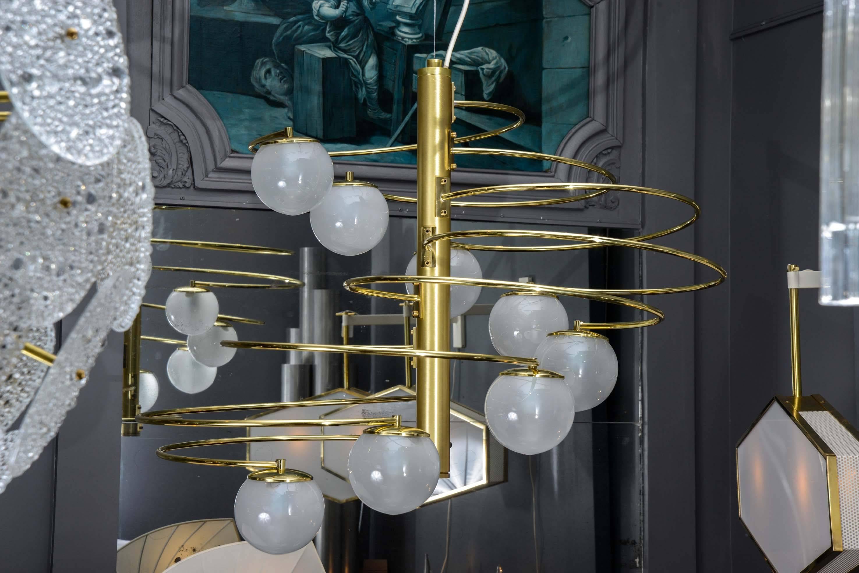 Very nice spiral chandelier original reference 1050 by Lumi.

Brass central stem and height curved arms holding small glass globes.