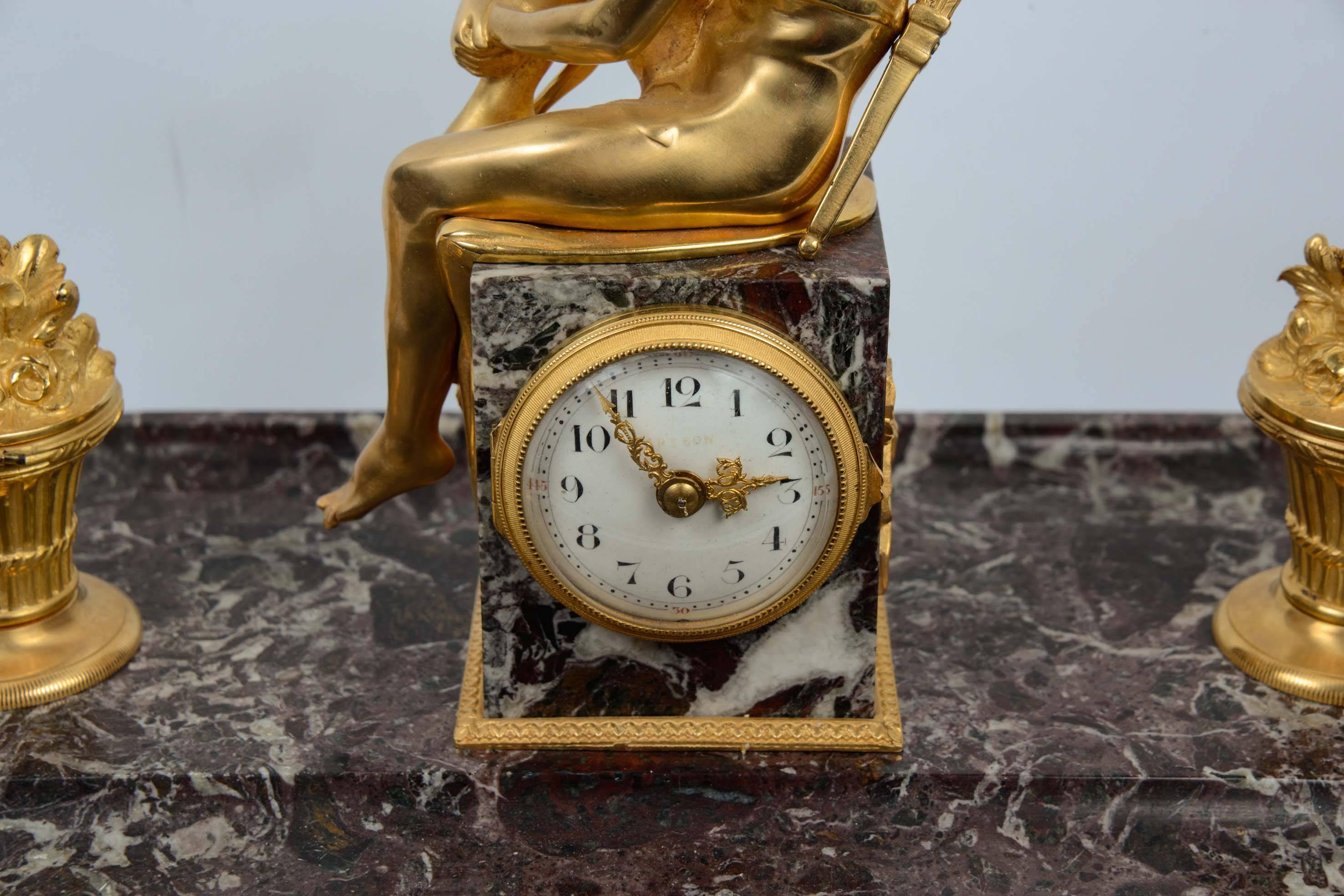 Very rare inkwell, with one clock on each side. Gilded bronze on a marble base.