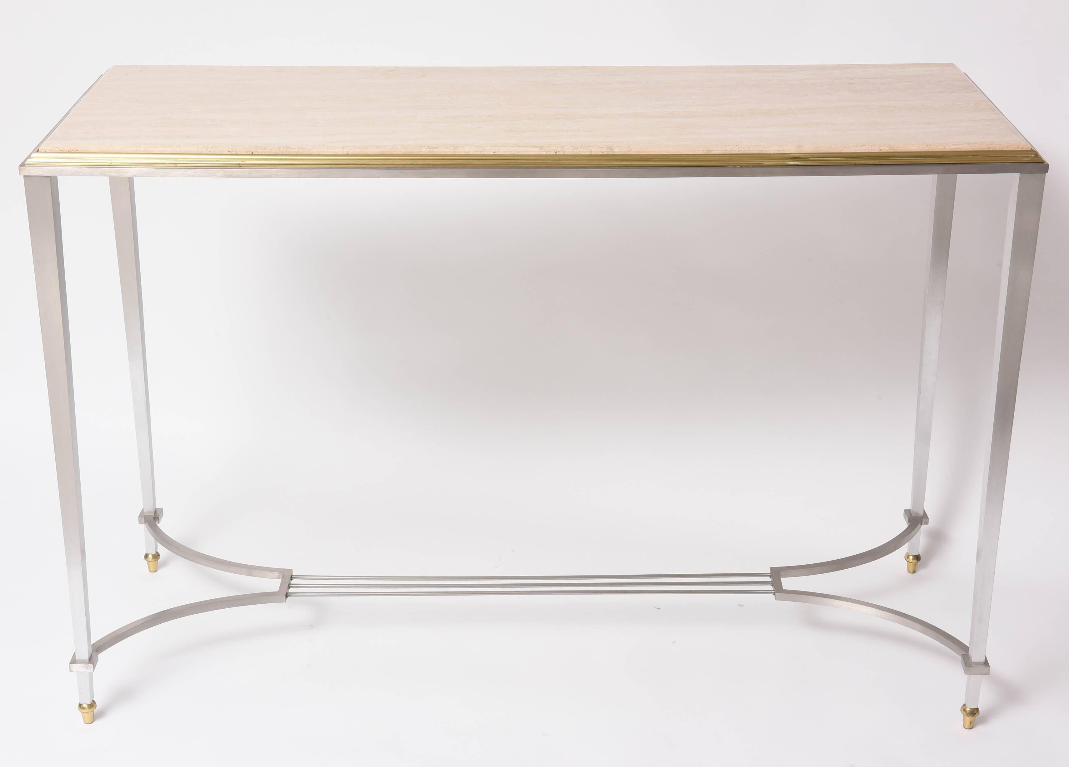 This stylish console is very much in the style of pieces created by the firm Maison Jansen. The materials are of the highest quality and its forms is quite lite and yet strong in appearance. 

