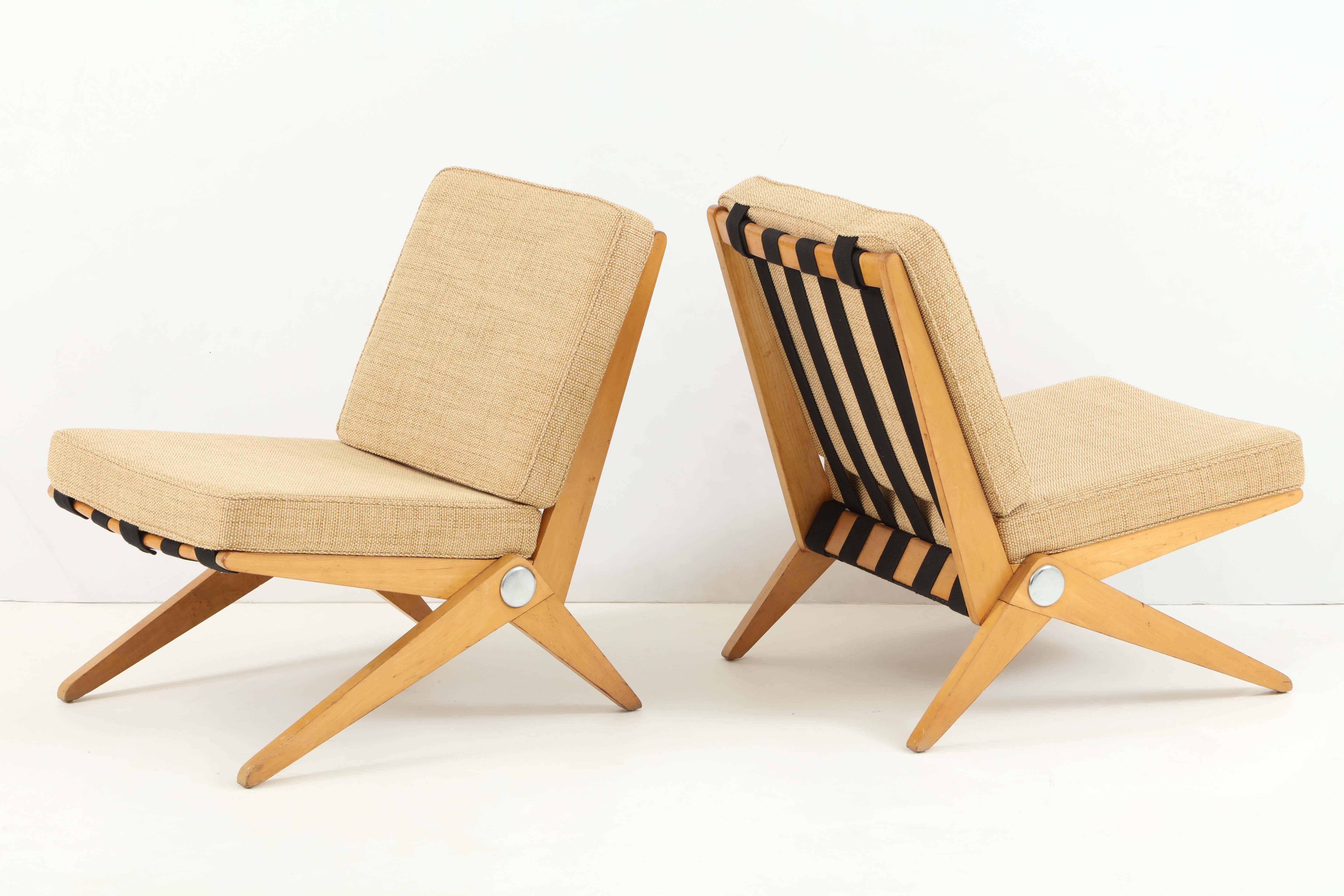 This pair of Classic Scissor chairs are in excellent vintage condition with reupholstered cushions.