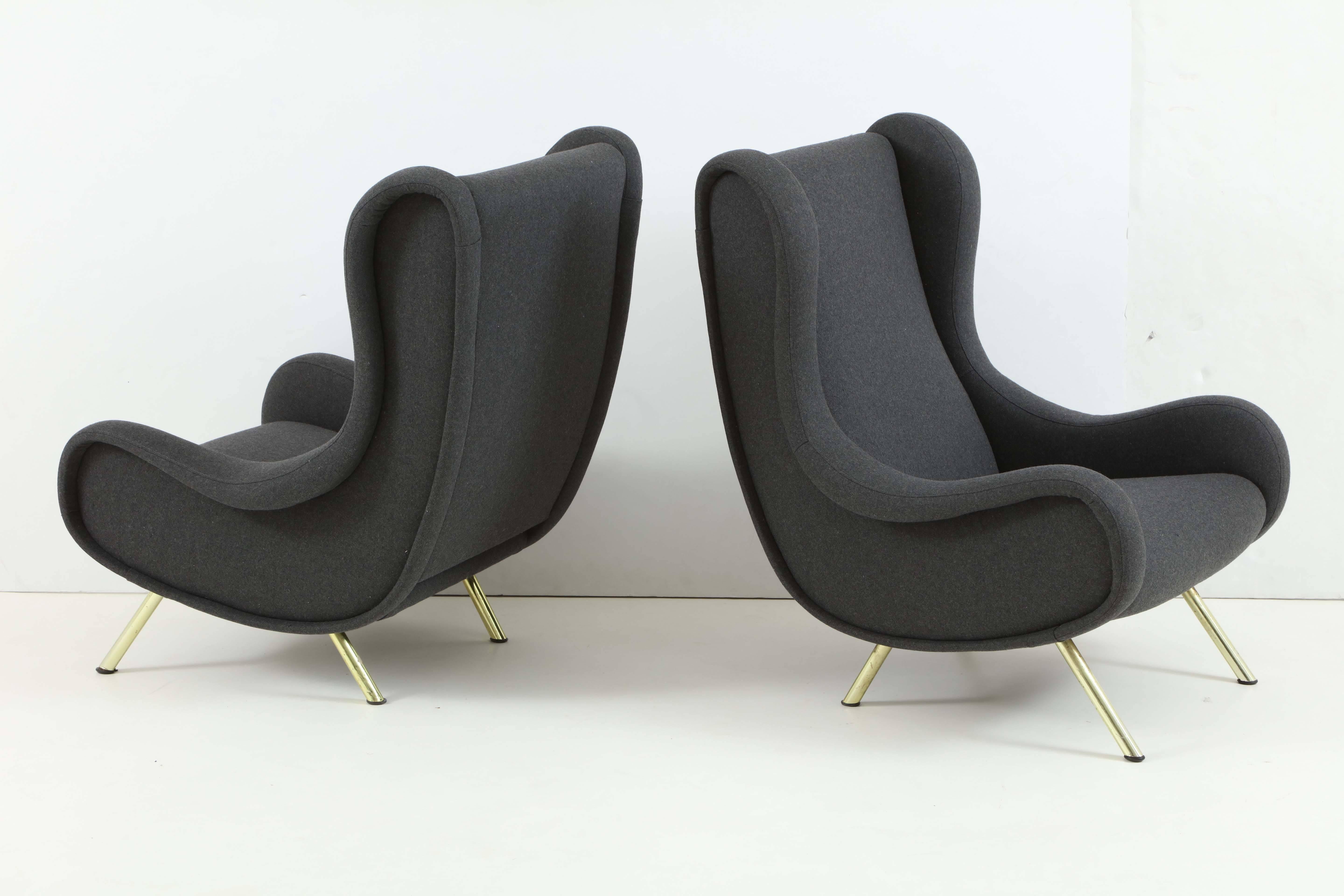 Pair of large armchairs reupholstered in grey wool, with brass feet. Designed by Marco Zanuso and manufactured by Arflex.