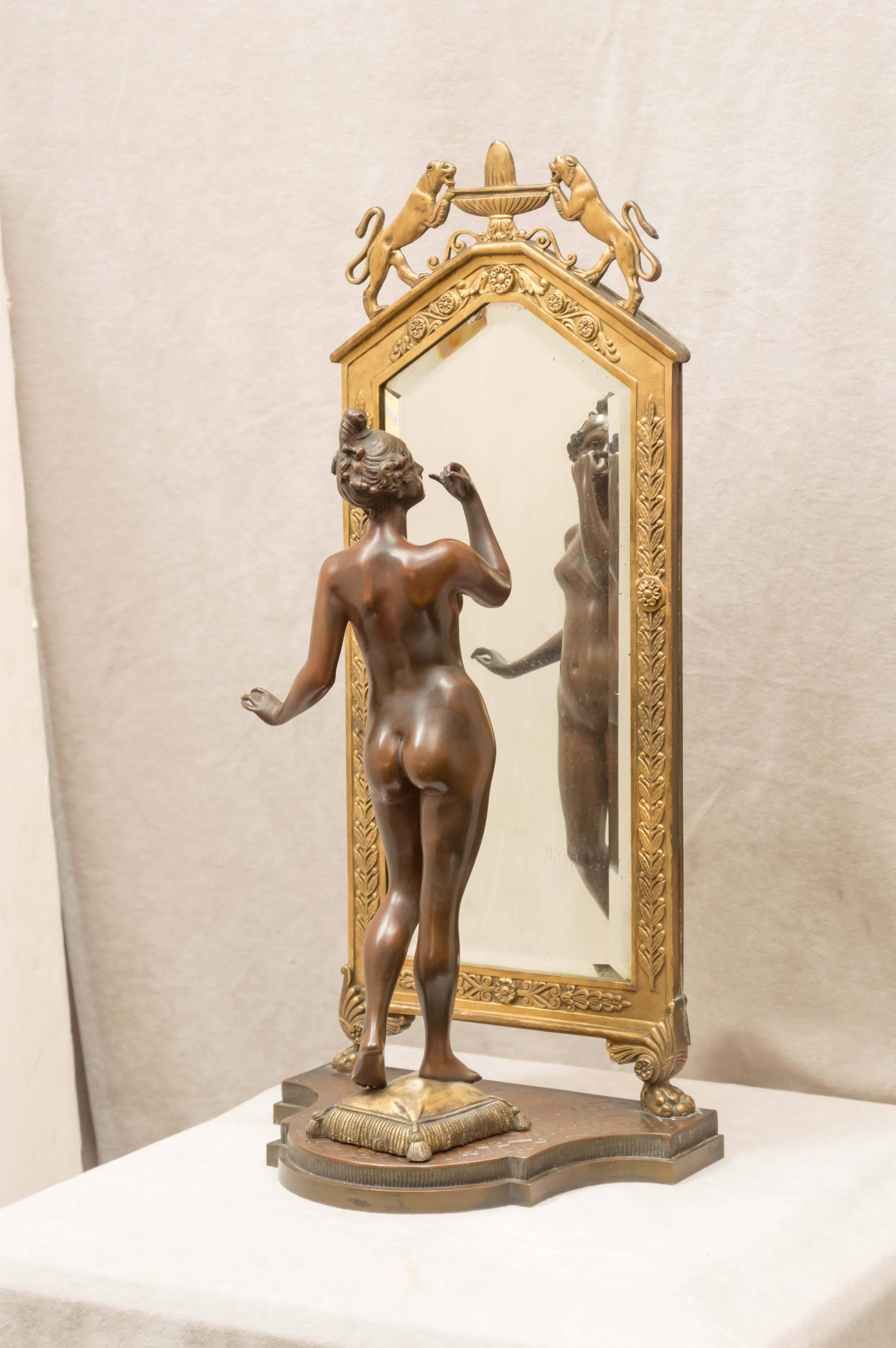 This is a very rare version of a smaller bronze that has the same girl looking in a standing mirror as well. We have owned the smaller version several times. For an example of the smaller version, please check 