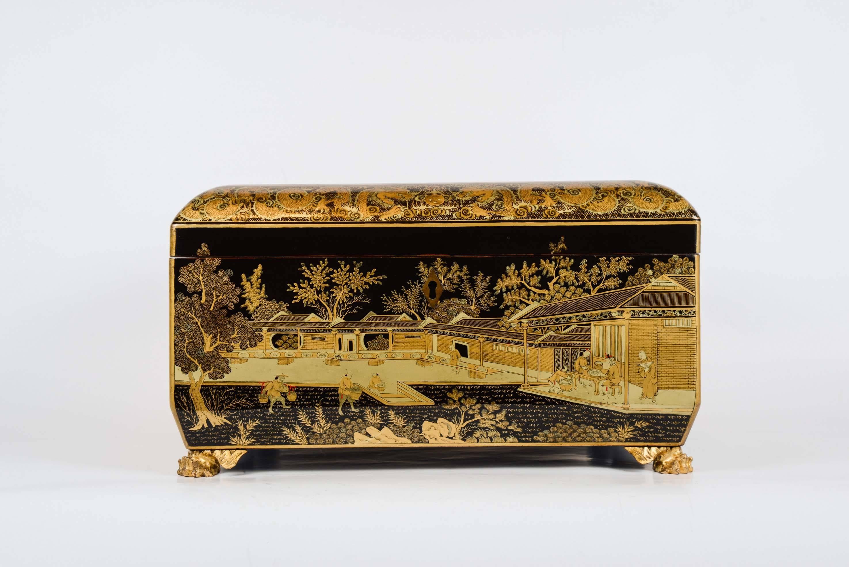 Large cabinet in canton black lacquer with gold scenes of domestic life in homes and landscapes. Very beautiful and rich decor. Dragon decor border. Black lacquer interior. The box rests on four carved and gilded feet. Copper keyhole and carrying