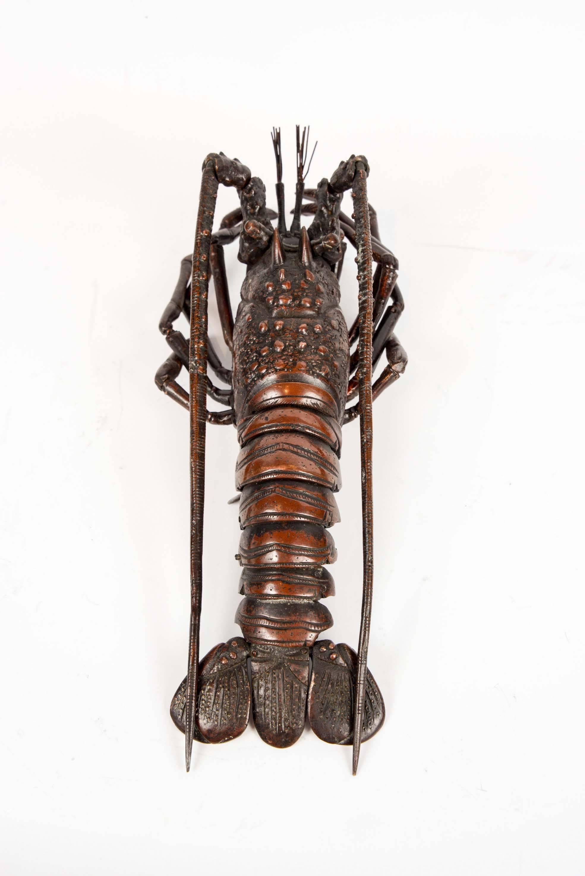 Outstanding fully articulated bronze lobster.
This type of object was made in Japan during the Meiji period. They had to have identical features and size as the represented animal. They are also known under the term 