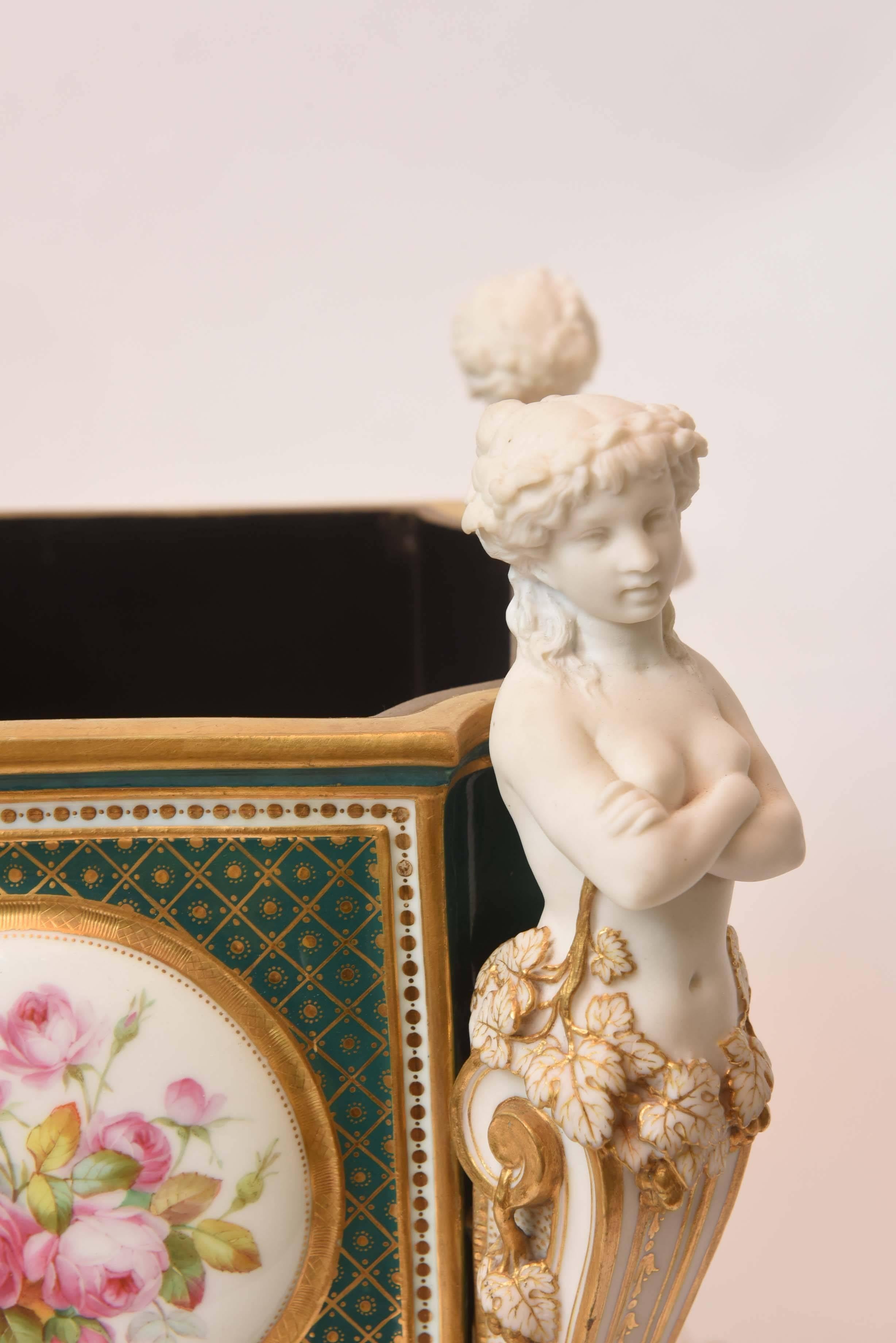 A pair of exhibition piece Minton planters with statues, circa 1880.