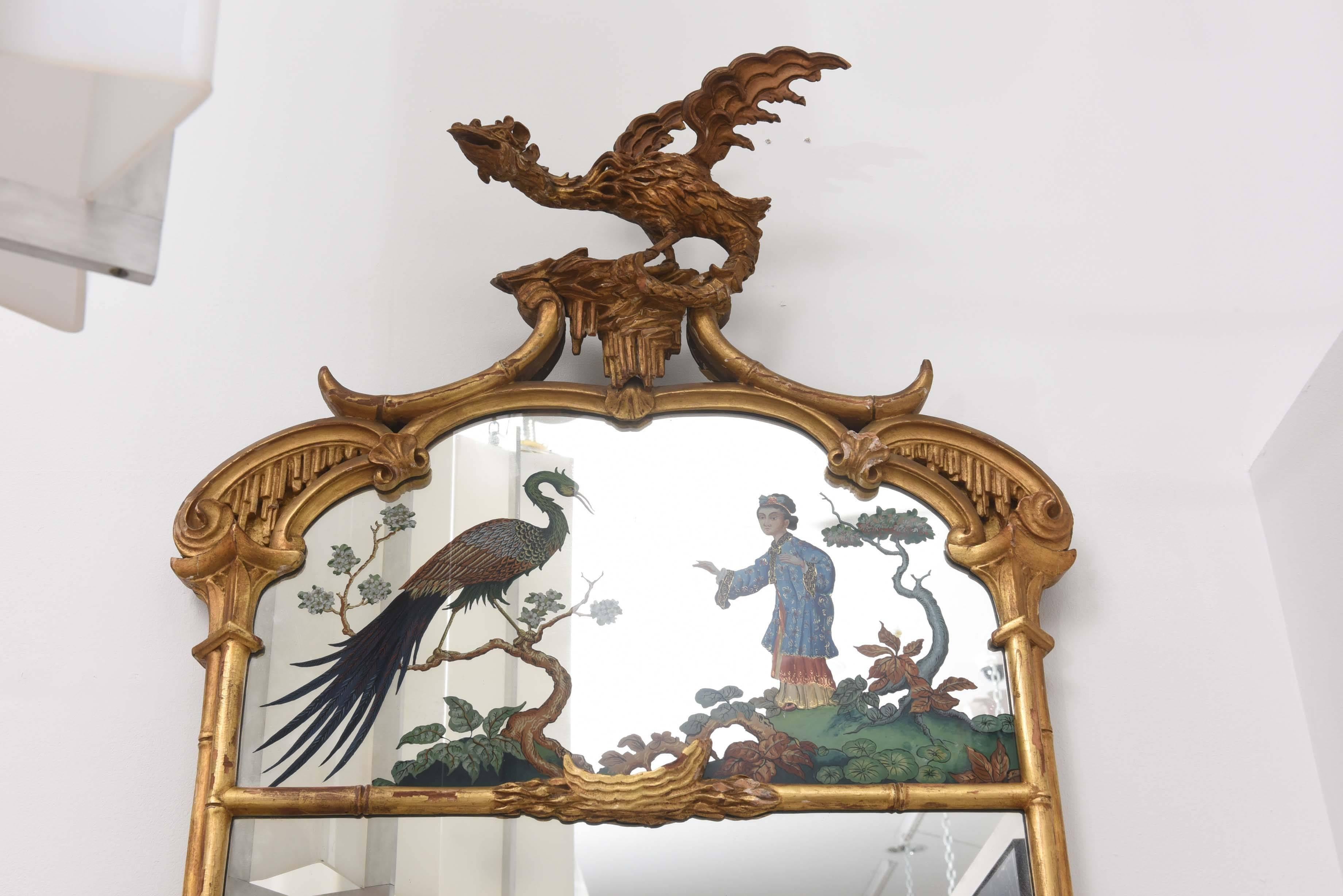 Pair of large Chinese Chippendale mirrors with reverse painted scenes.