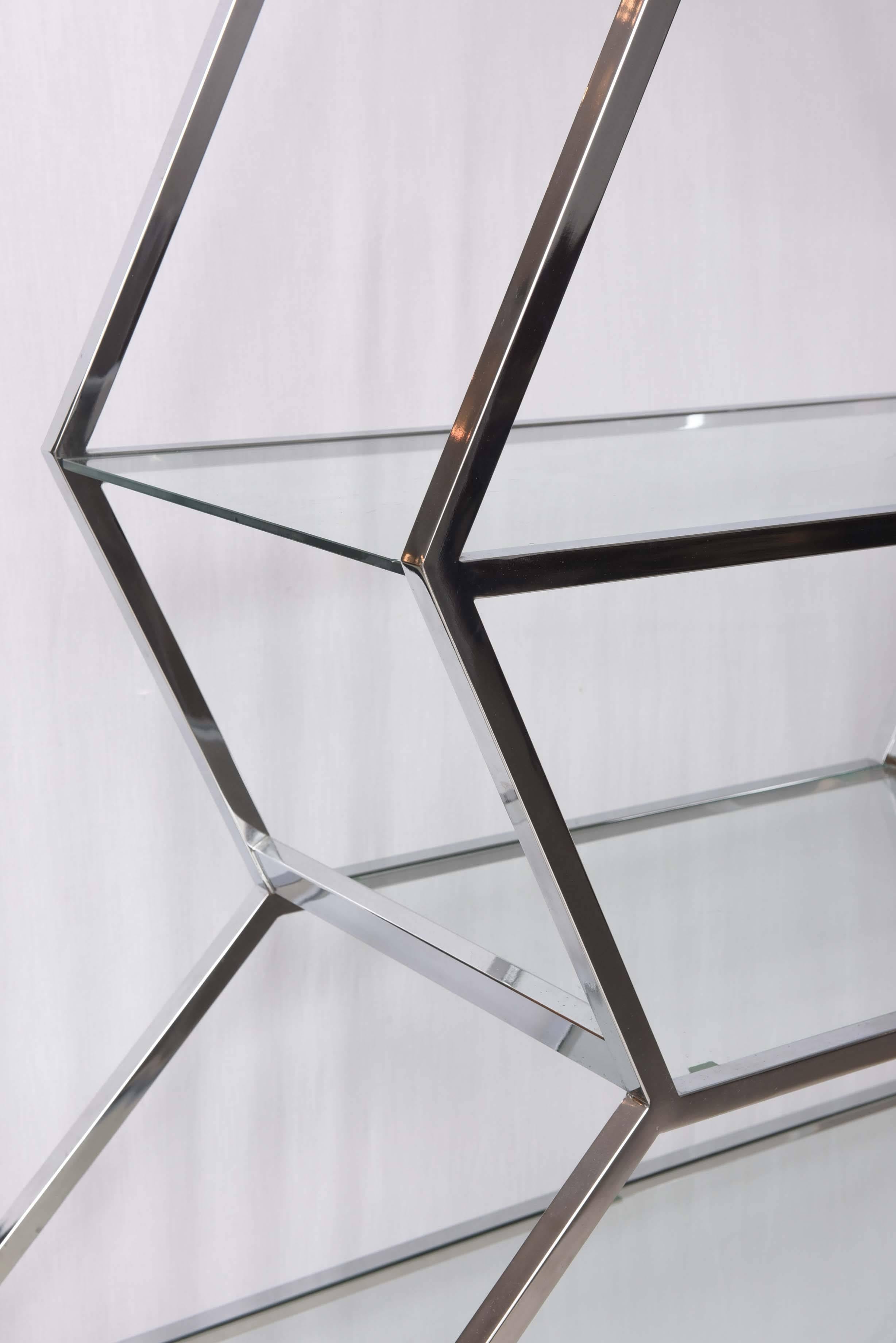 Large chrome and glass etagere with glass shelves.