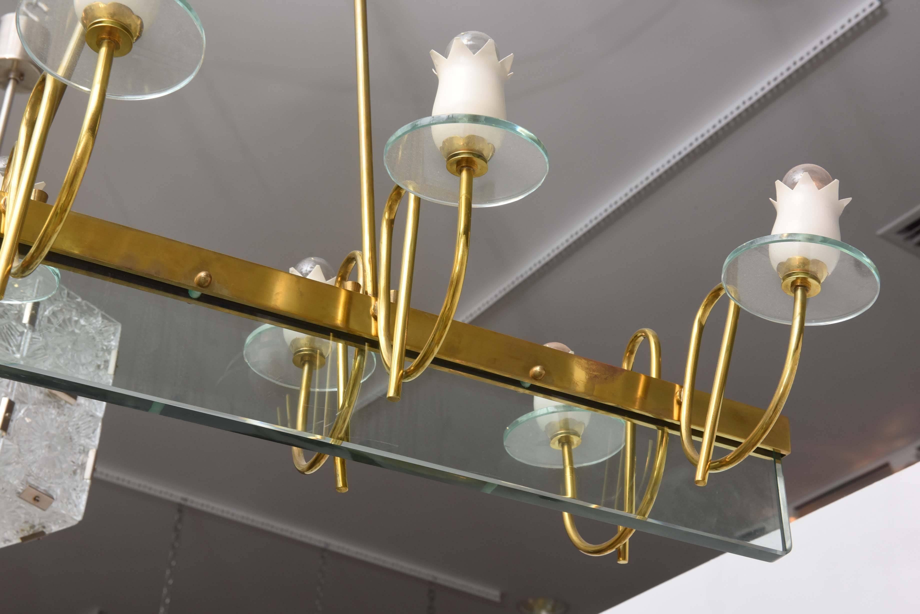 Brass and glass chandelier with enameled metal floral sockets in the style of Fontana Arte.