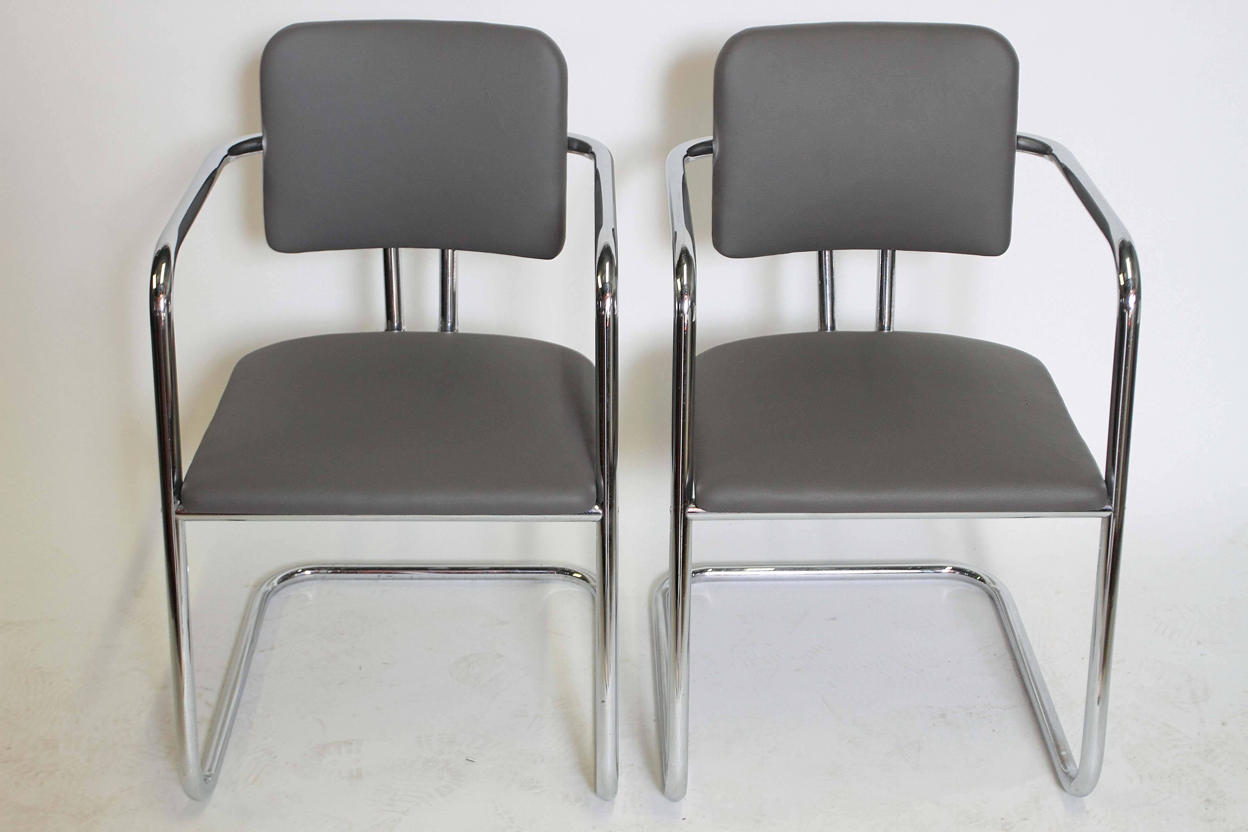 Simply not the common Rohde side and armchairs seen frequently, and attributed loosely.
Rare signed pair of Troy cat #185 club chairs.
Canted and cantilevered streamline arm chairs.

Circa 1935, restored, new leather and studs, exc. original