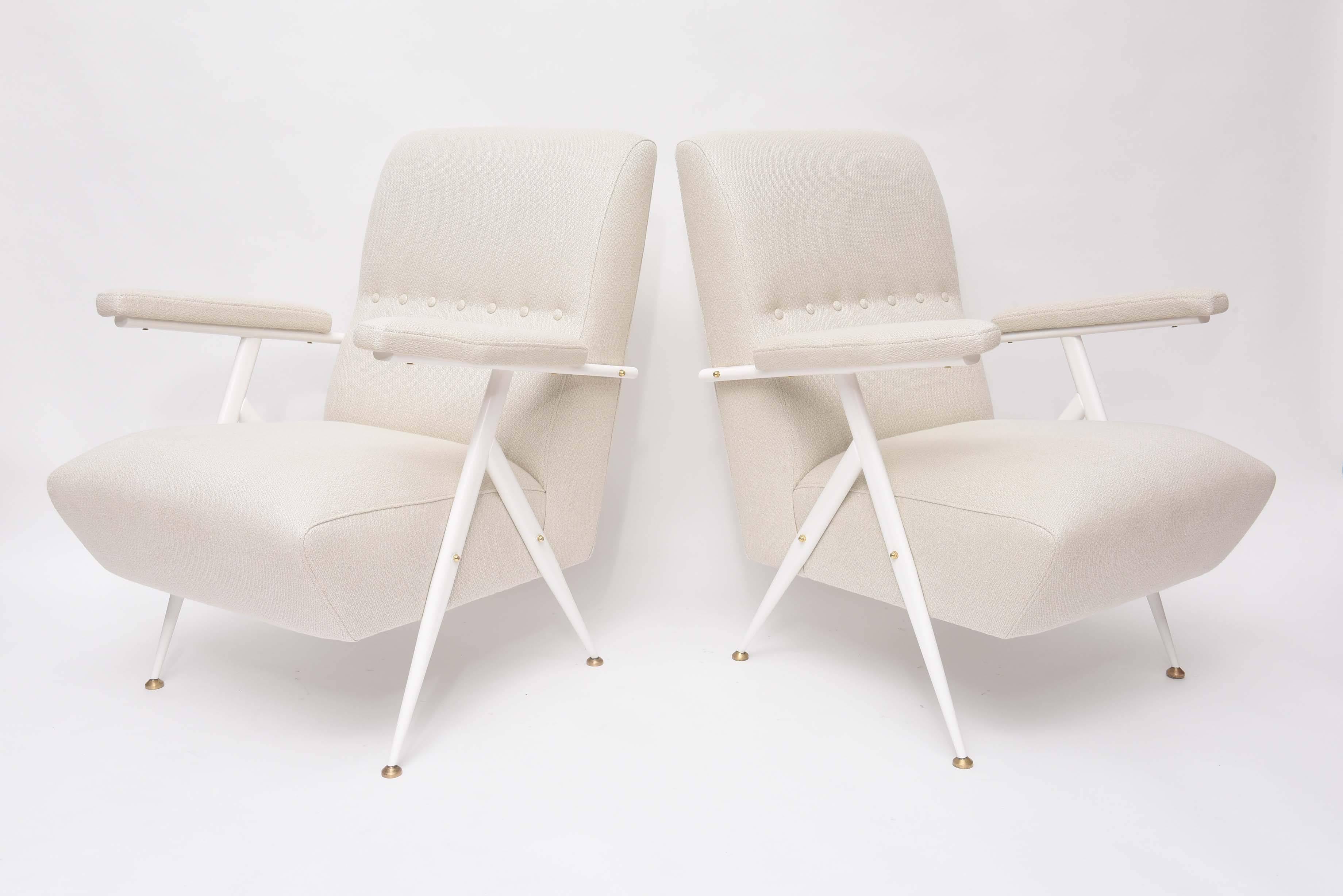 Stunning pair of 1950s Italian lounge chairs in the manner of Angelo Ostuni. Superbly restored off-white metal frames with original brass details. New foam, upholstered in luxurious, thick, bone Belgian linen. We swoon!