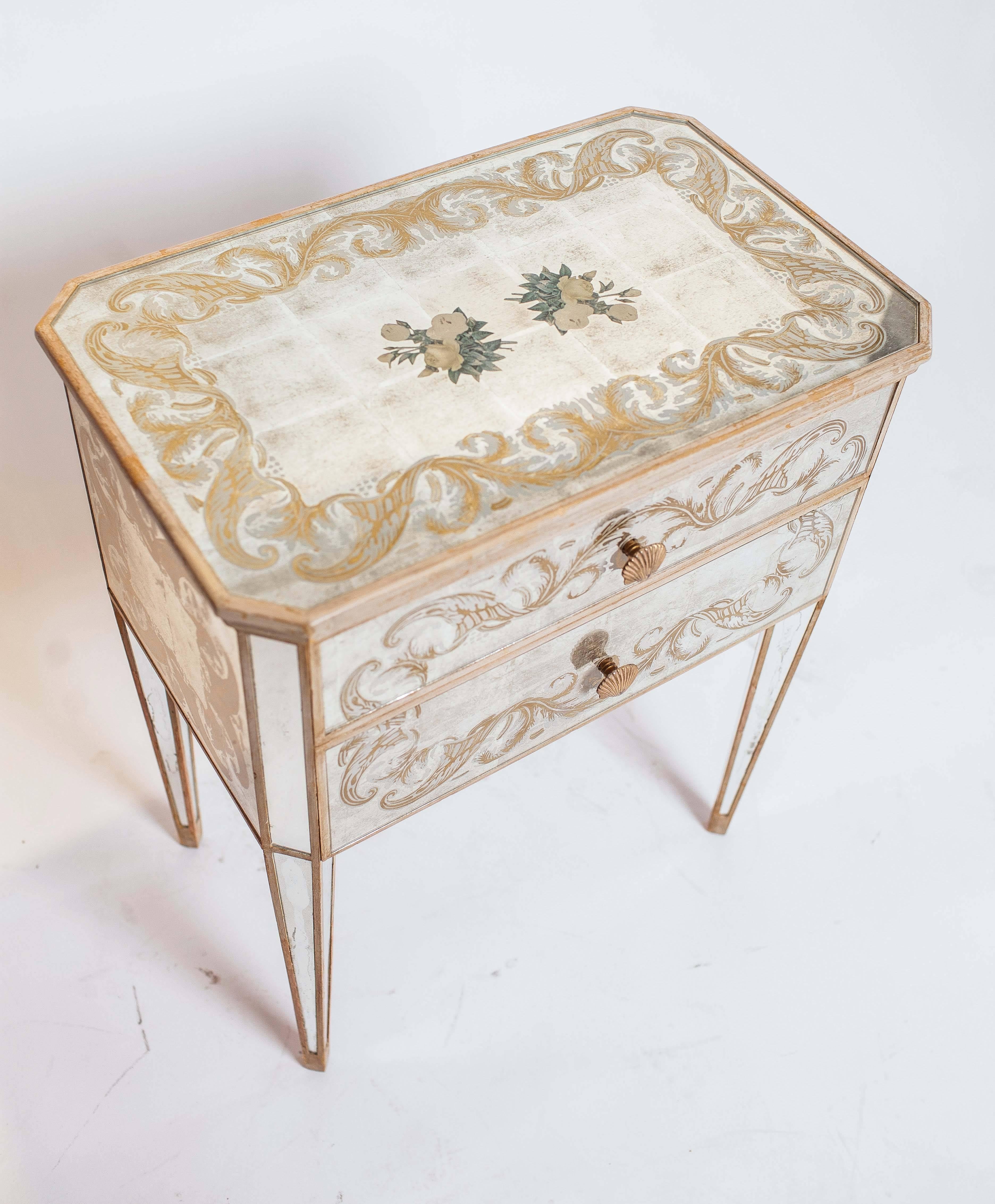 Side tables have two drawers and are finished on all sides.  The hardware is a brass shell motif.  Silver leaf decoupage.  