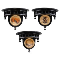 Set of 3 Aesthetic Movement ebonized wall shelves with hand painted scenes