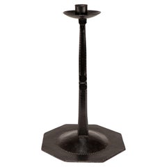 Ernest Gimson & made by Alfred Bucknell. A rare unusually tall steel candlestick