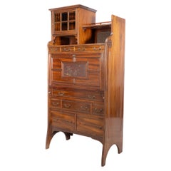 Antique Lambs of Manchester. An Anglo-Japanese secretaire bookcase with lacquered panel