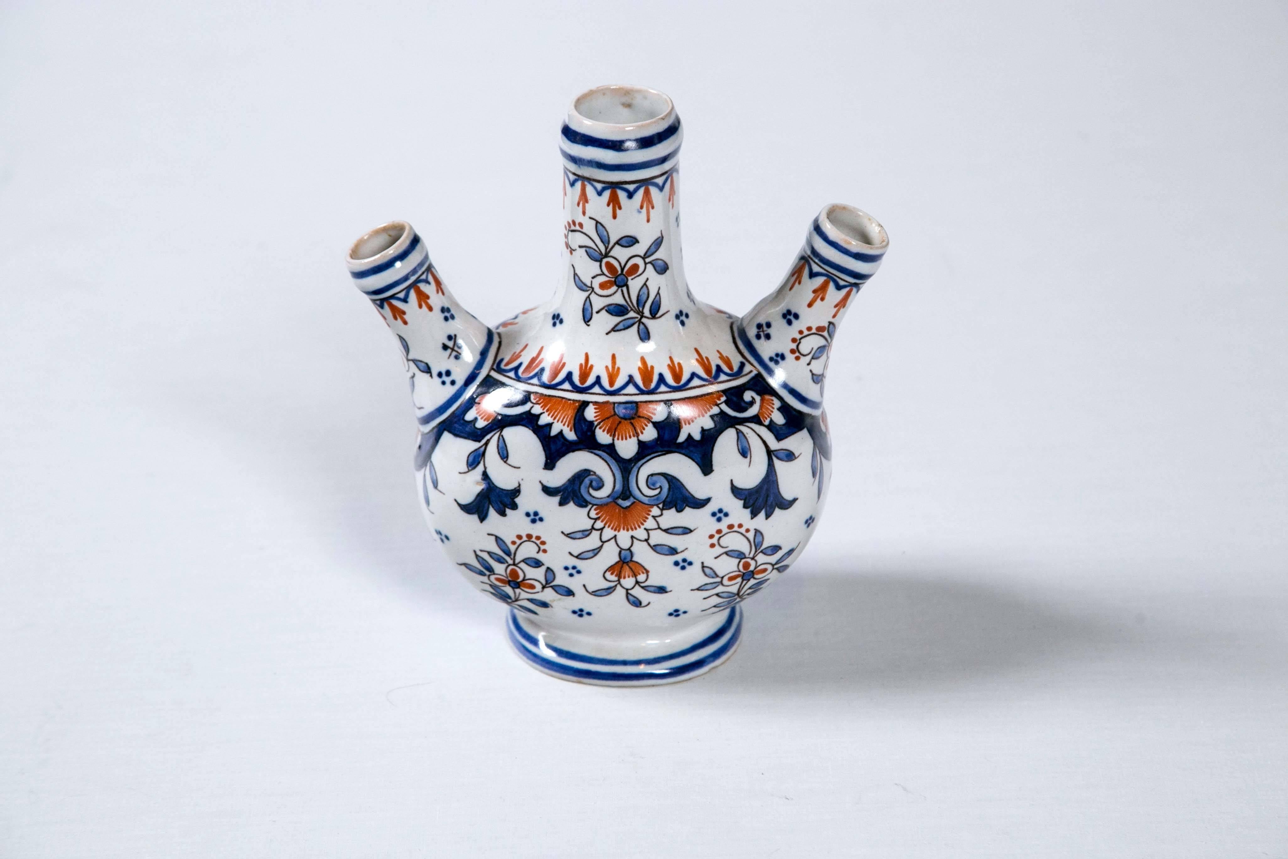 Beautiful Tulipiere vase, circa 1900, Rouen, France. Three separate spouts for flowers. Traditional orange, blue and white pattern of Rouen.