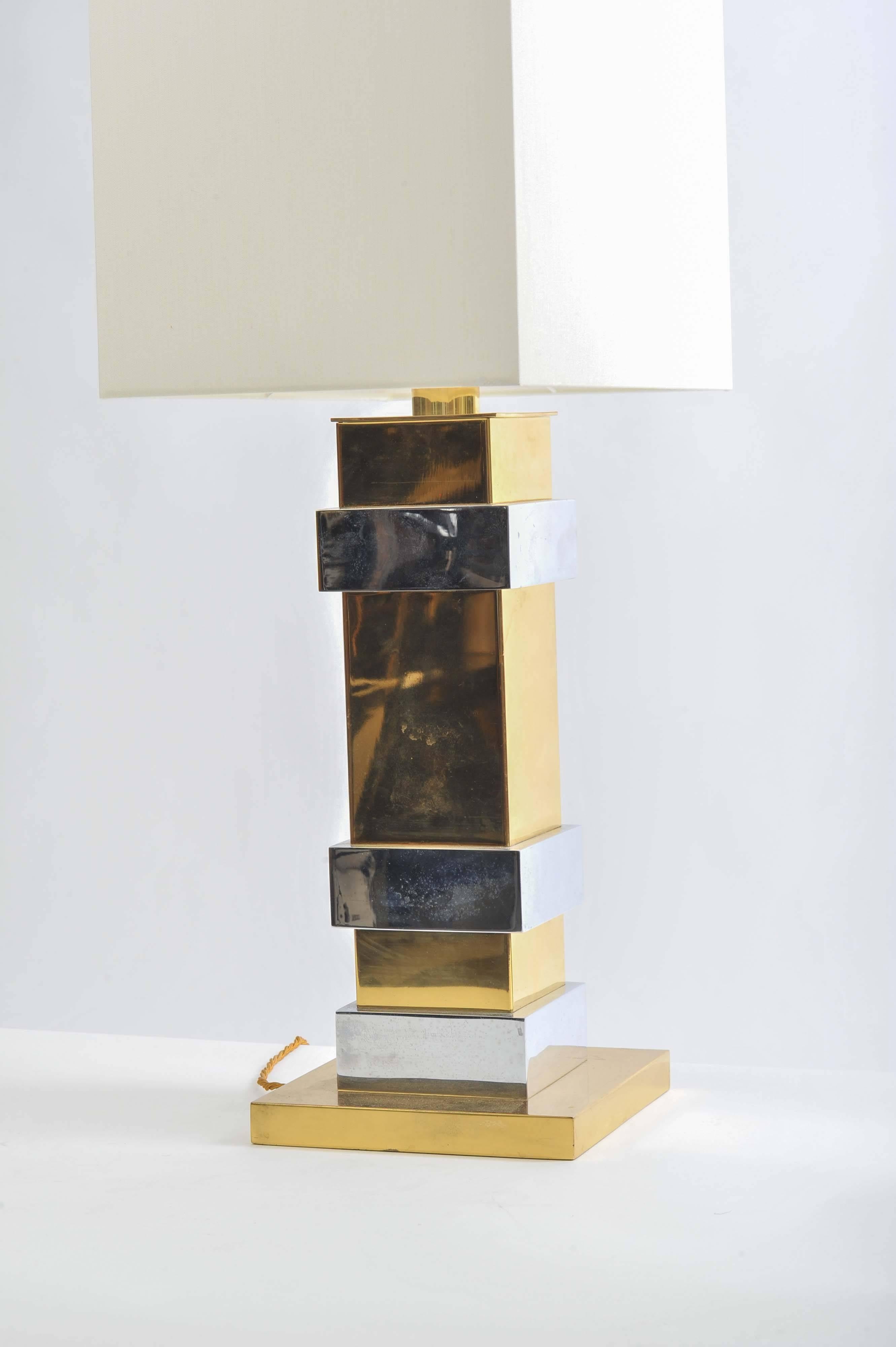 Large classical rectangular lamp base with alternating segments of brass and chrome. This single table lamp comes with a rectangular silk lampshade.