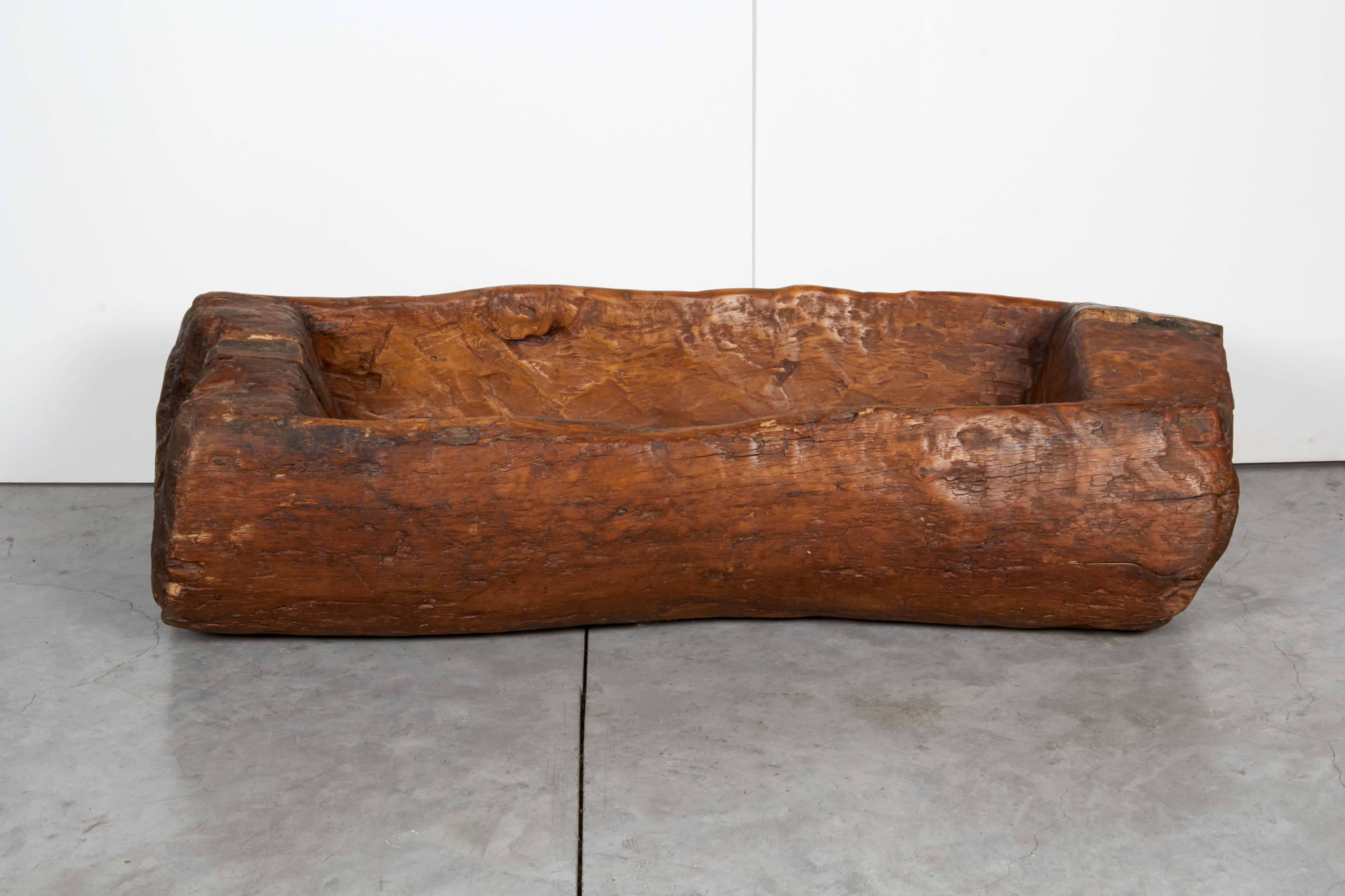 A very thick, sturdy antique horse trough from Shanxi Province, China. Carved out of a solid piece of elmwood, circa 1900.
M580.