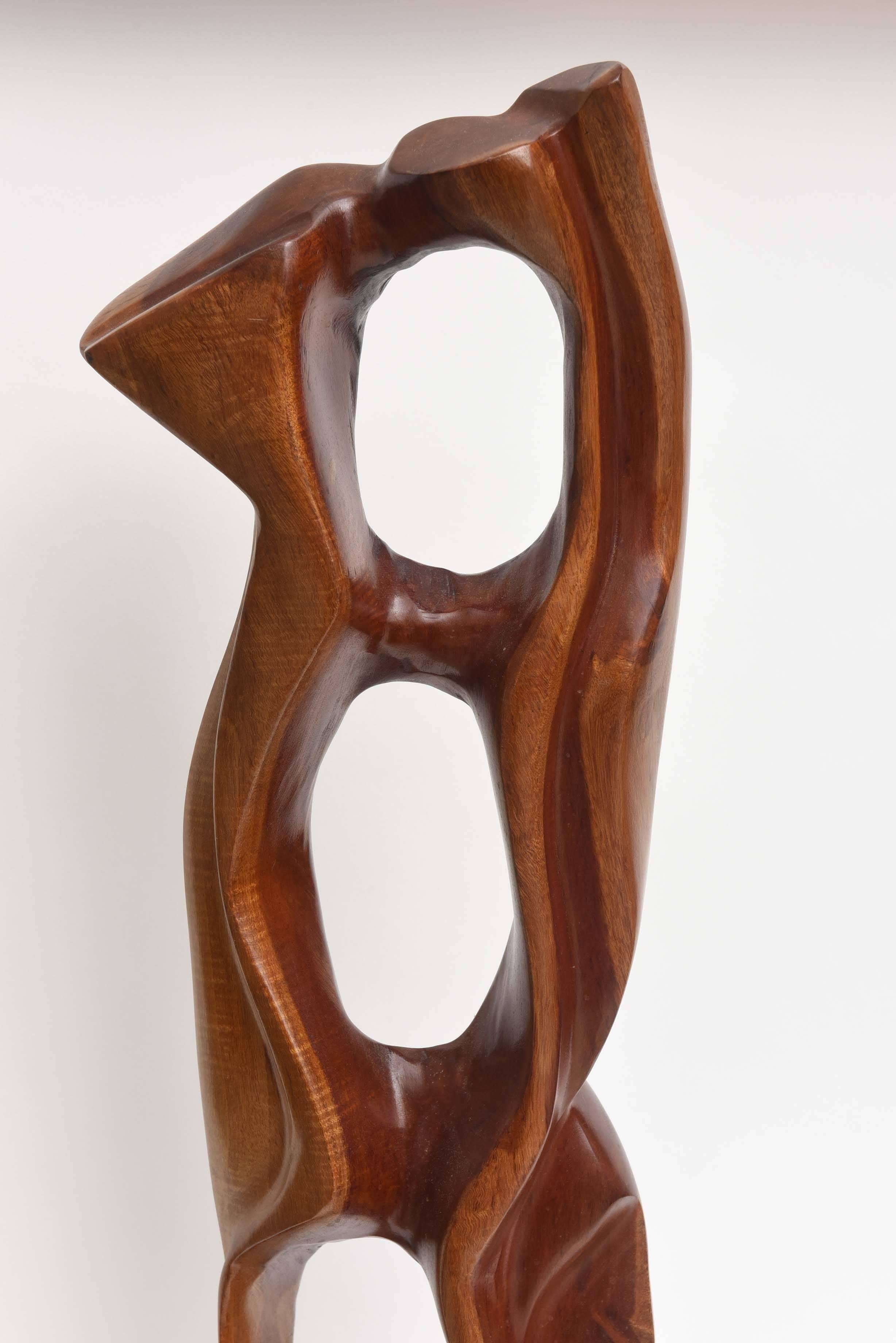 Beautifully carved in mahogany by renowned argentine sculptor Raul Varnerin, signed..