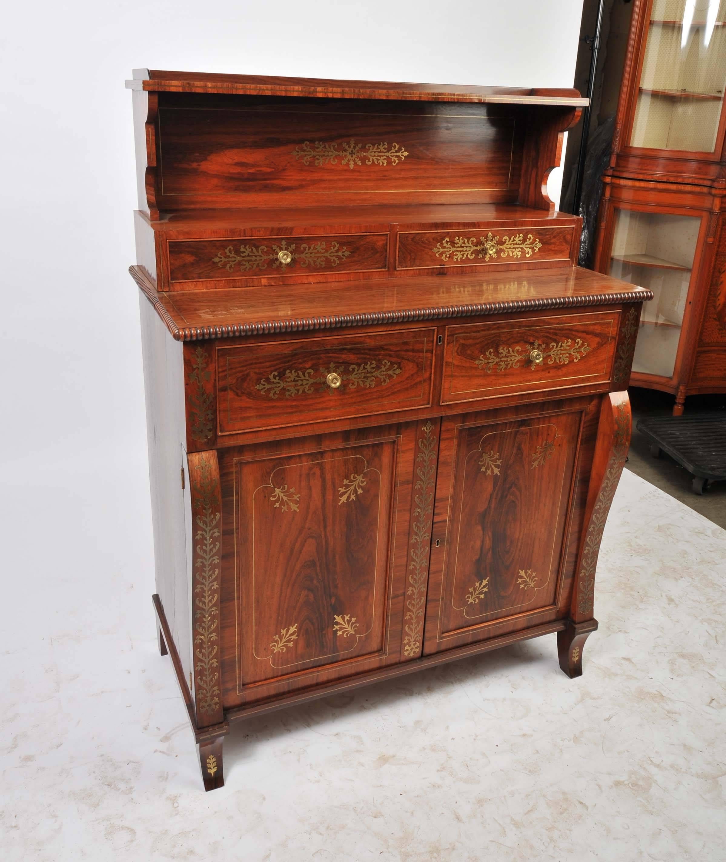 A very good quality Regency period rosewood chiffonier, having classical brass inlay and a secretaire drawer.