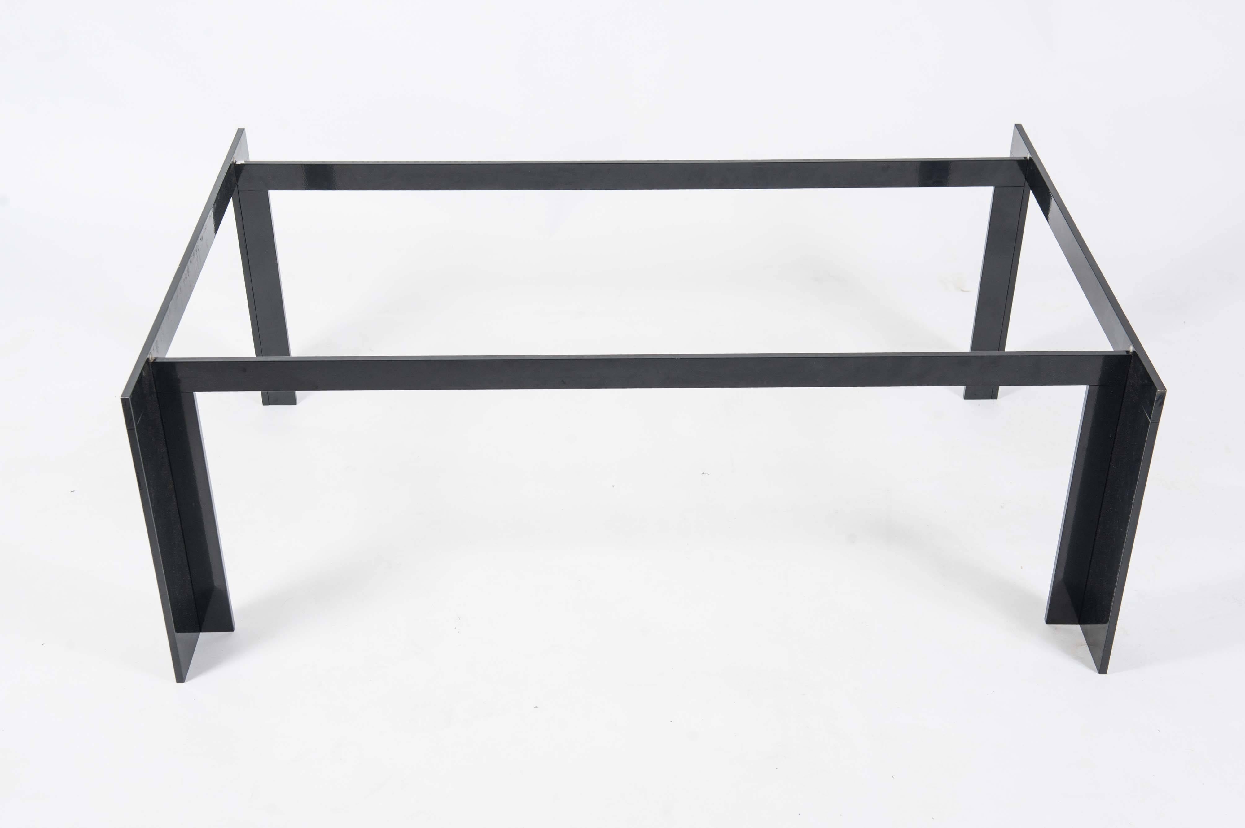 Elegant midcentury coffee table with reinforced grey smoke glass on a black powder coated steel frame.
Suits a lot of interior styles: (post) modern, midcentury, Hollywood Regency, American classical, the Bauhaus, Brutalist, De Stijl, International