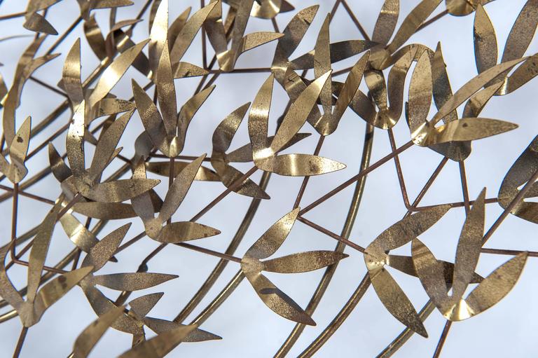 Chic and refined, this wall sculpture made of brass will bring extra sparkle to any space. 

Signed C. Jeré, 1980.